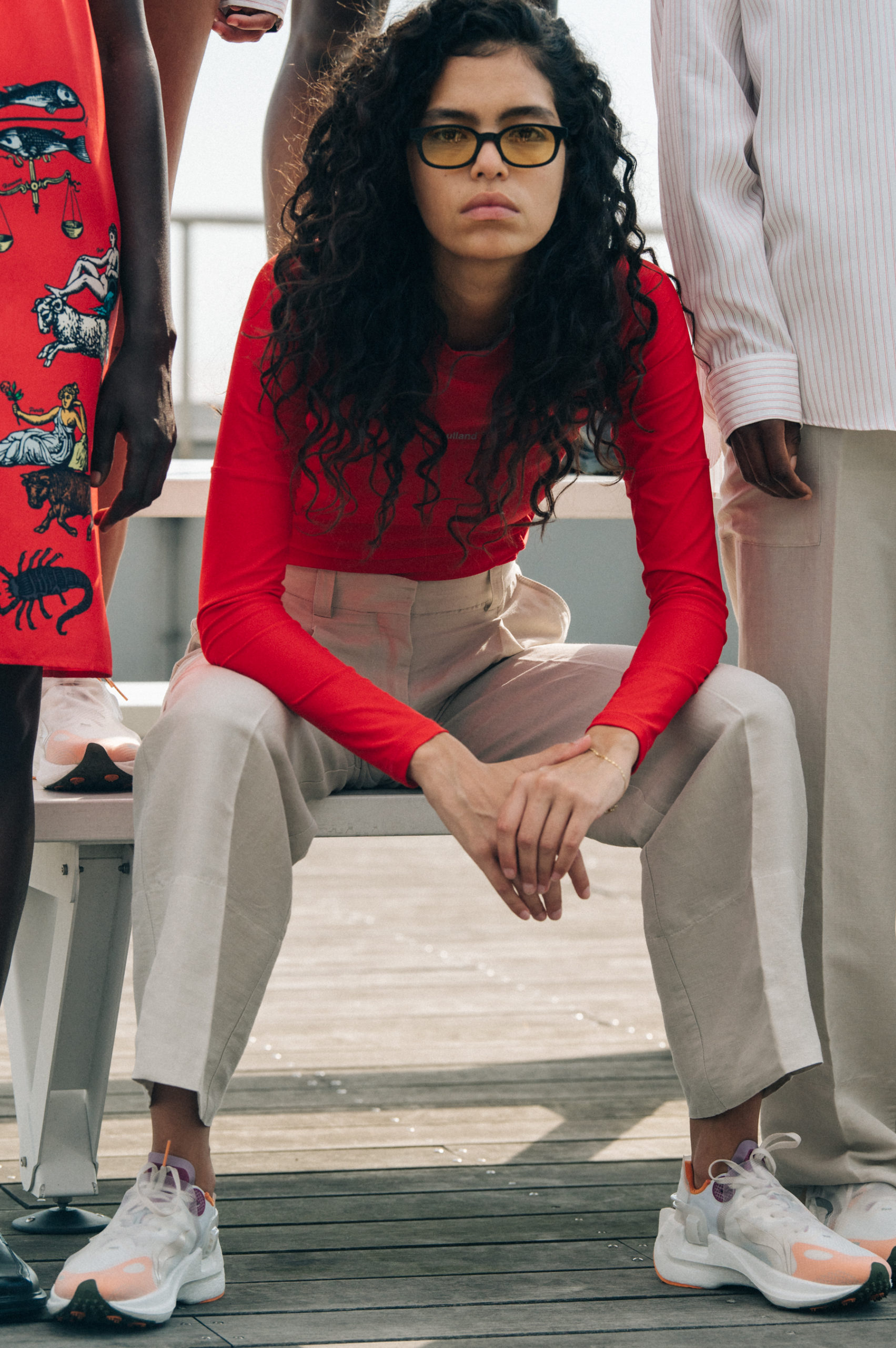 Model wearing red Soulland clothing