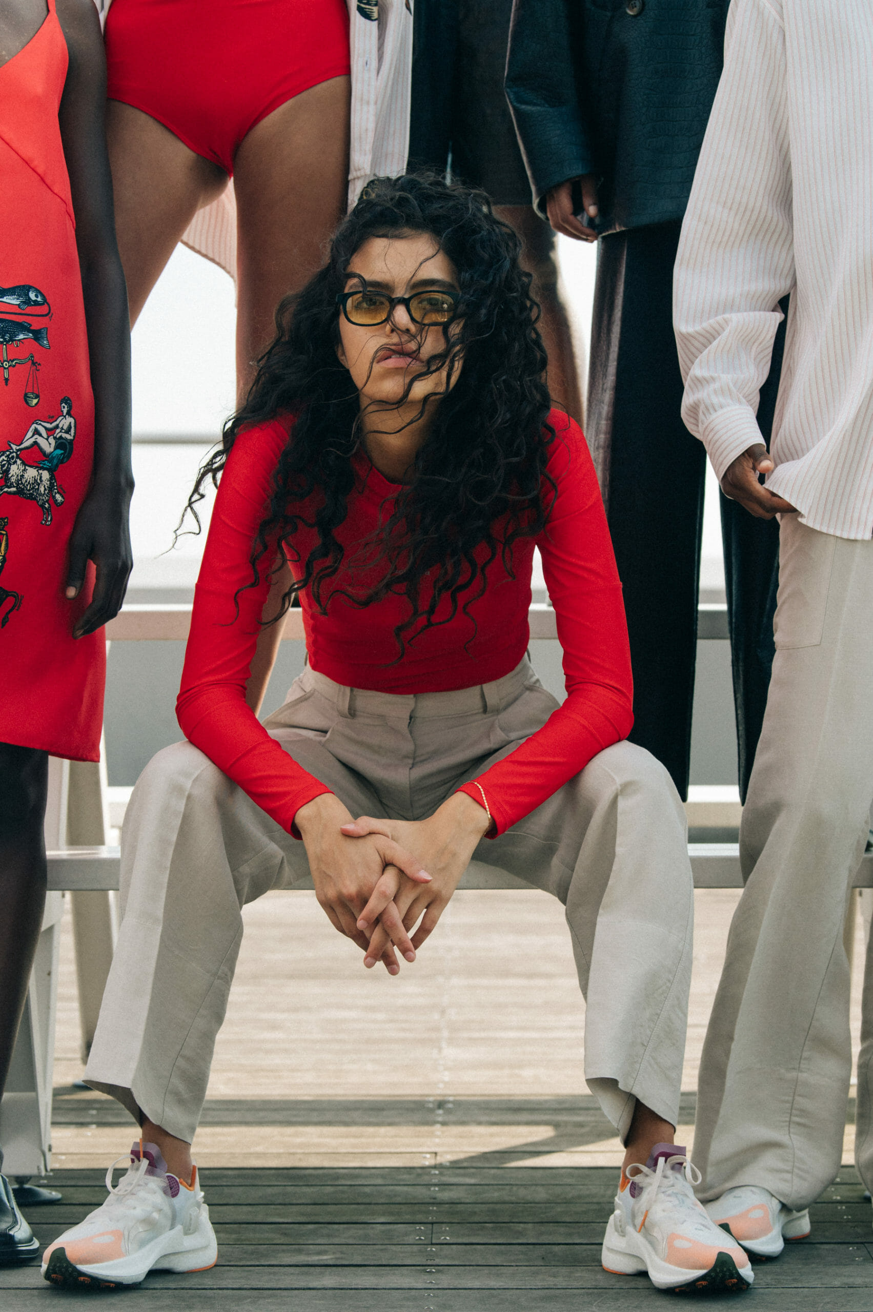 Model wearing red Soulland clothing