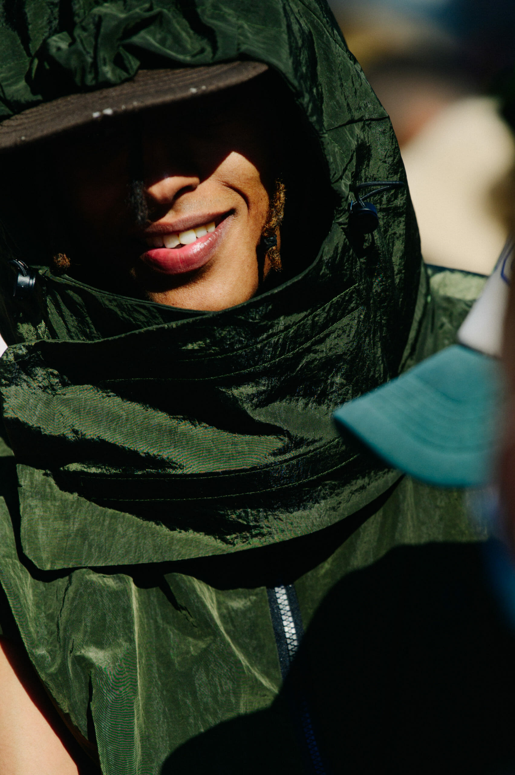 Man wearing green hood