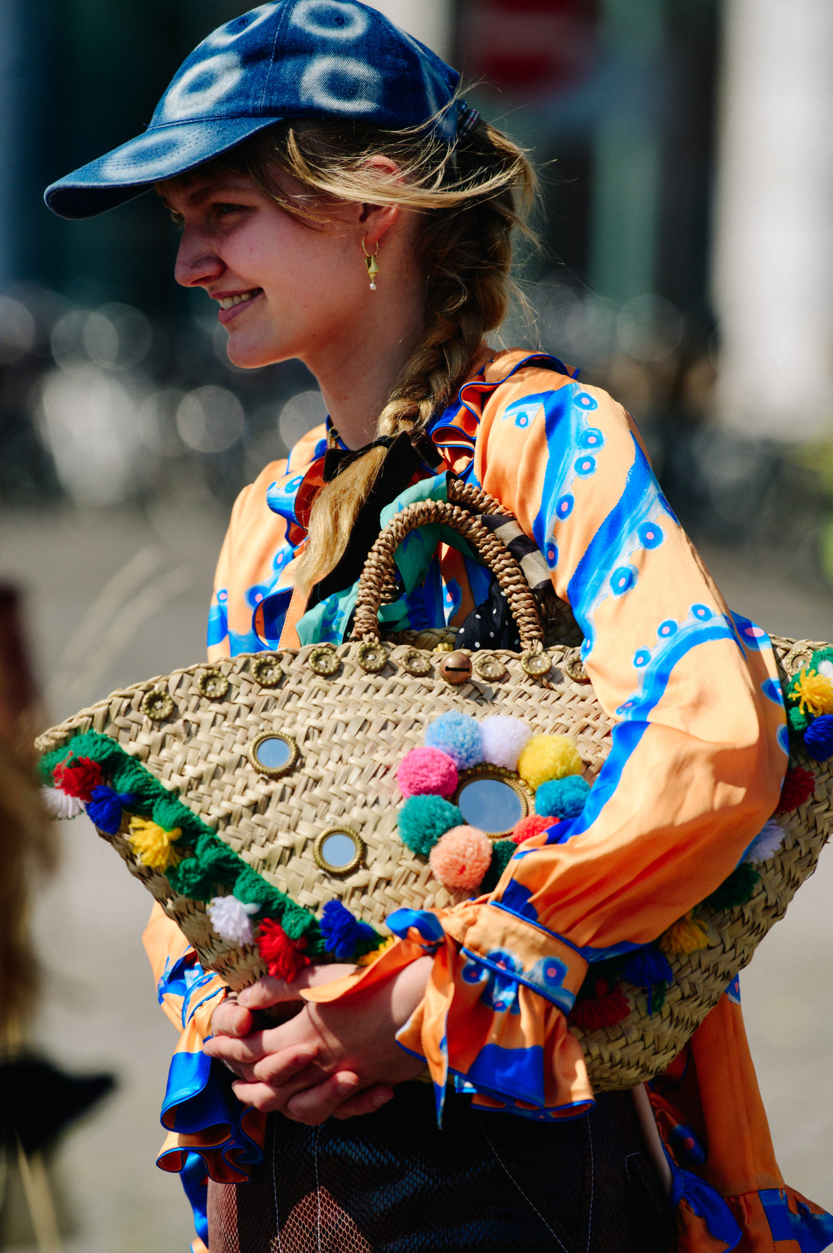 Woman carrying striped bag