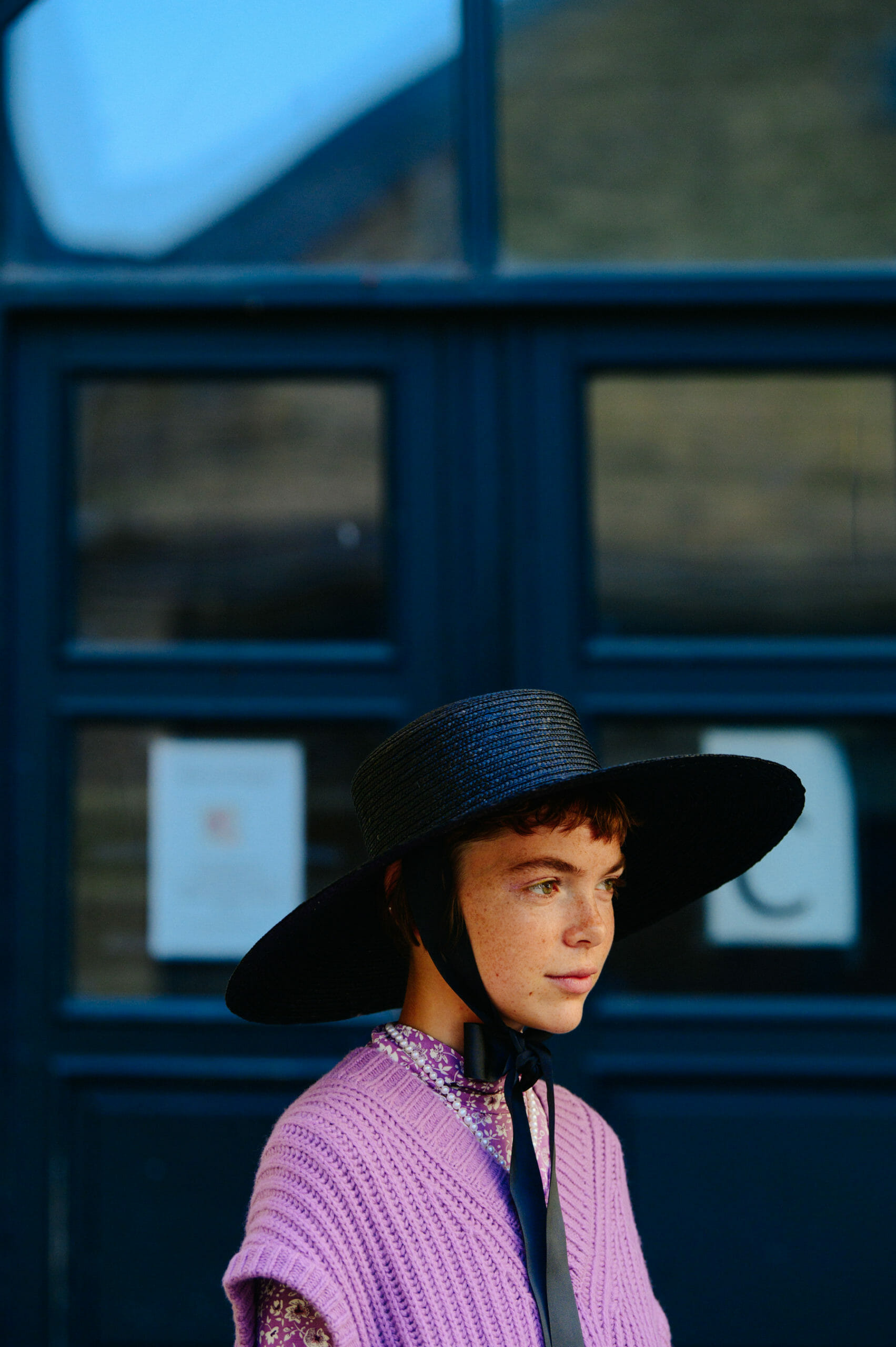 Woman wearing purple knitwear