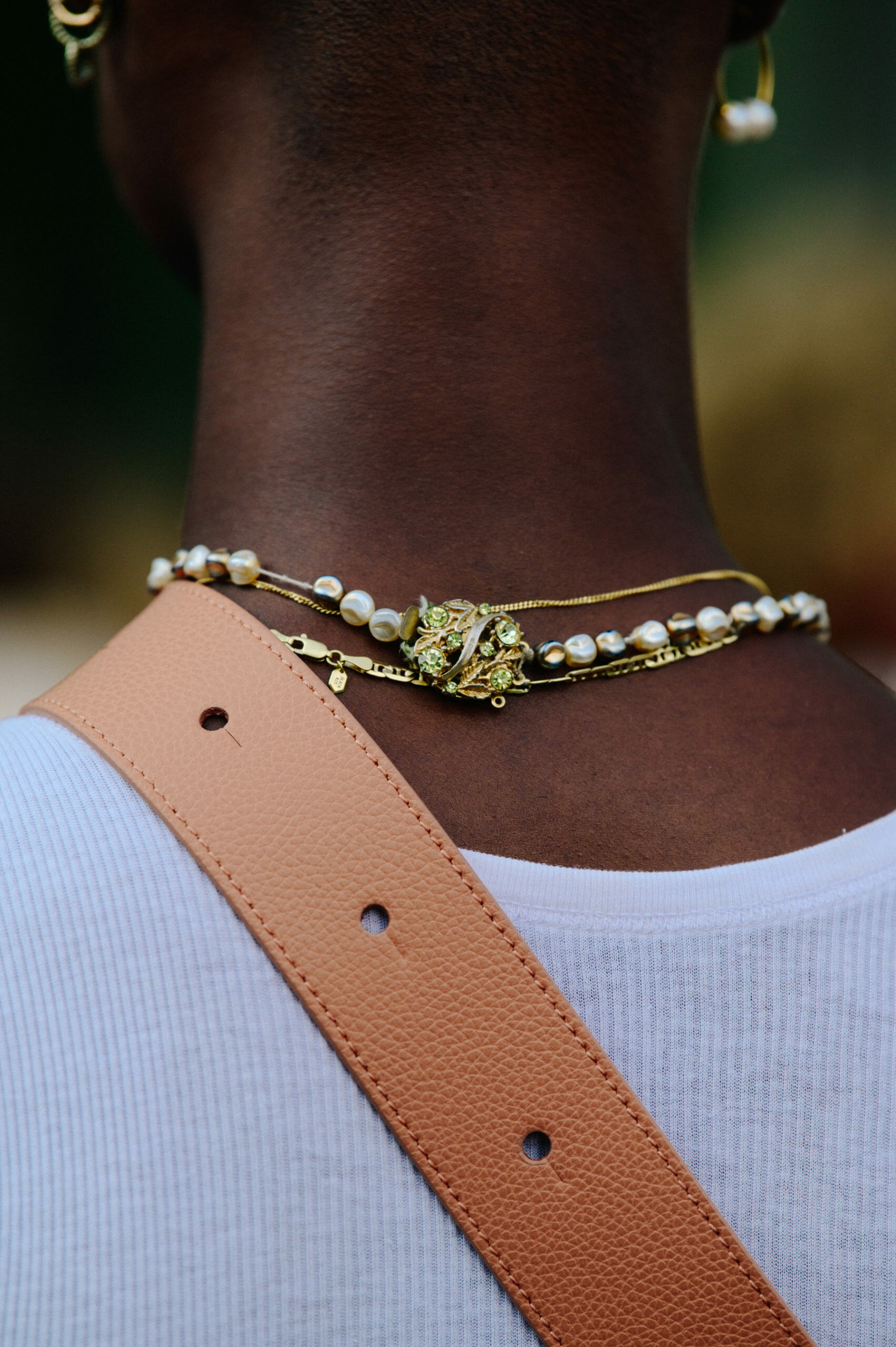 Man wearing gold necklace