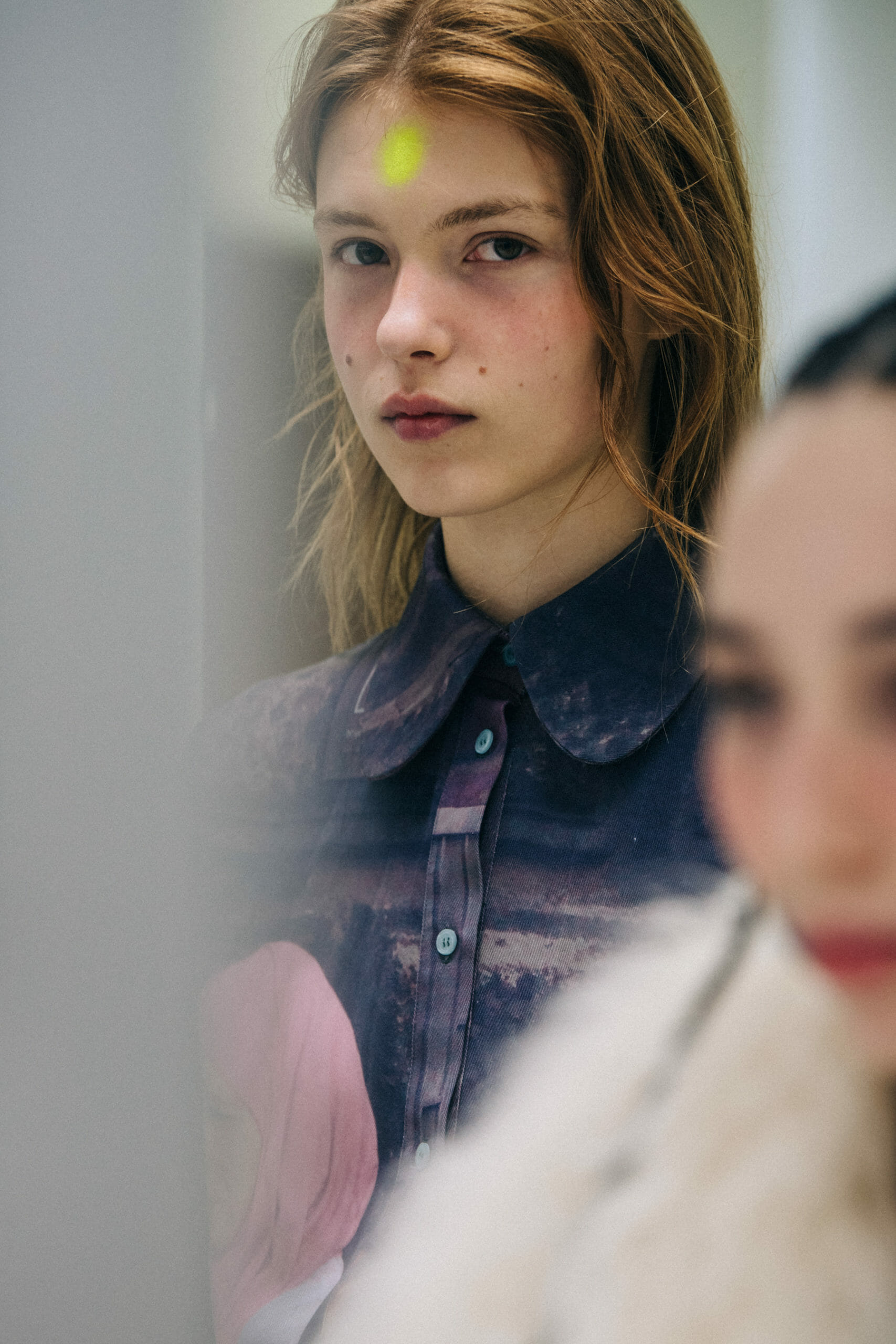 Models wearing lilac backstage