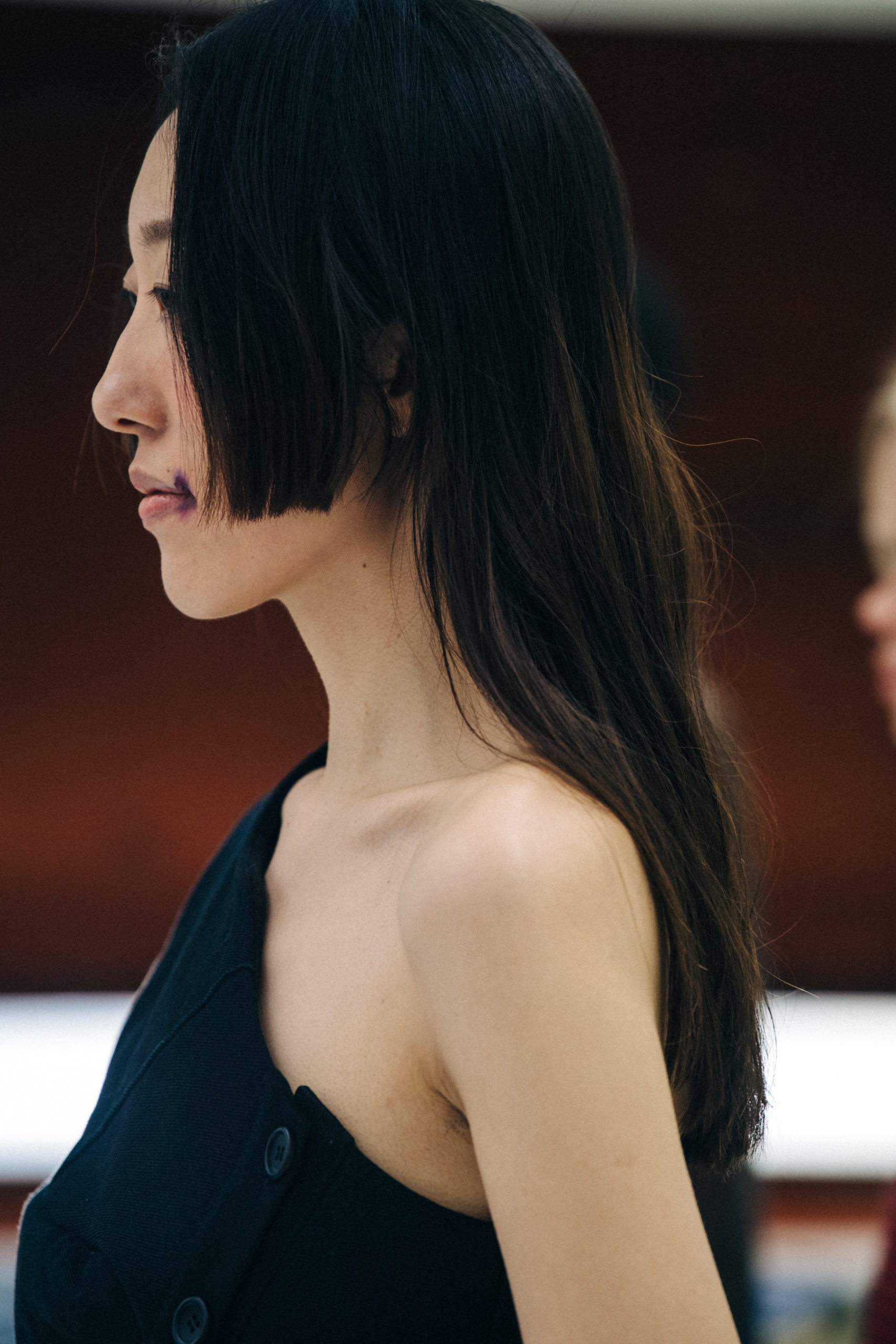 Model wearing dark blue dress