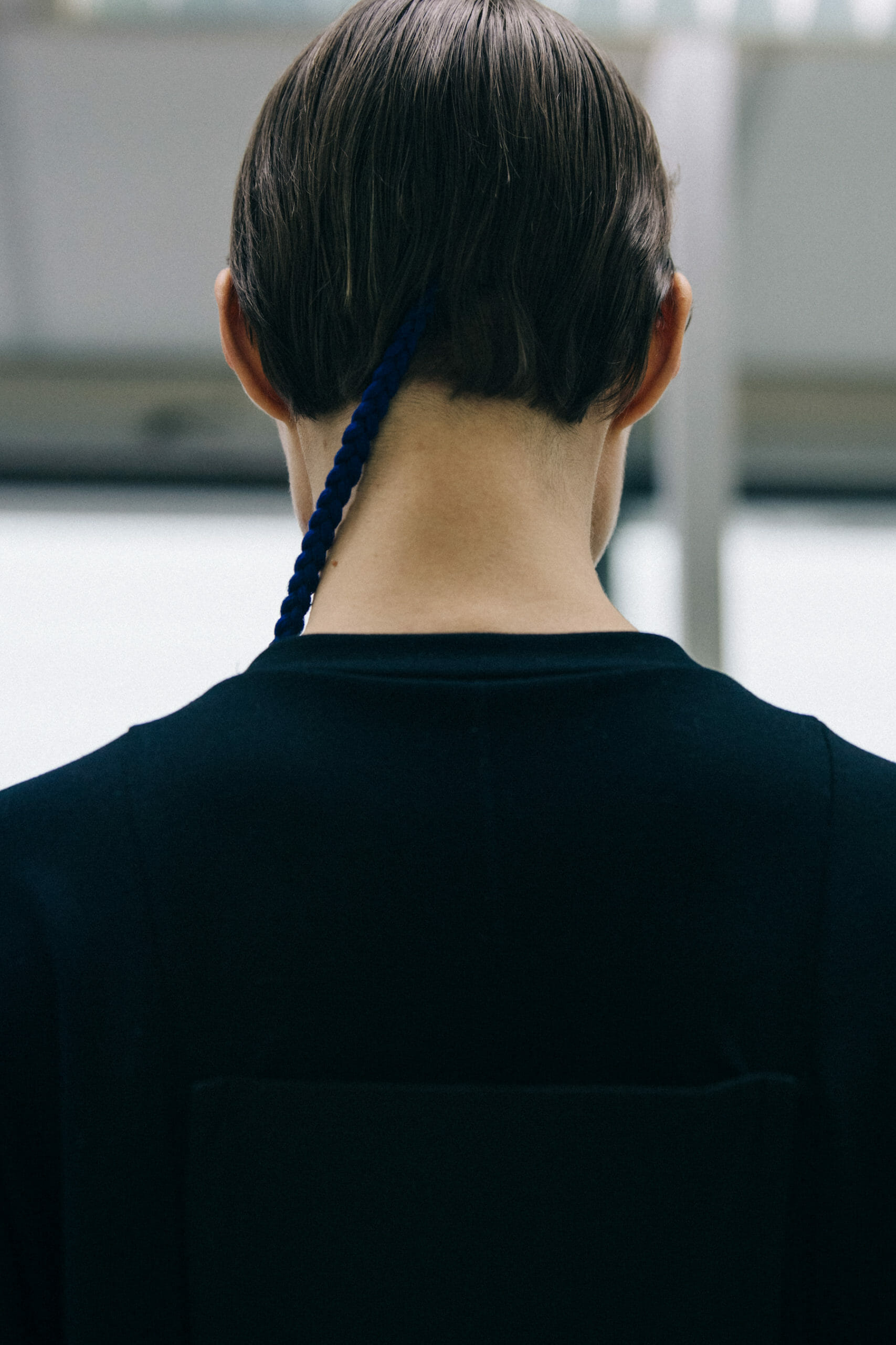 Model with long blue braid