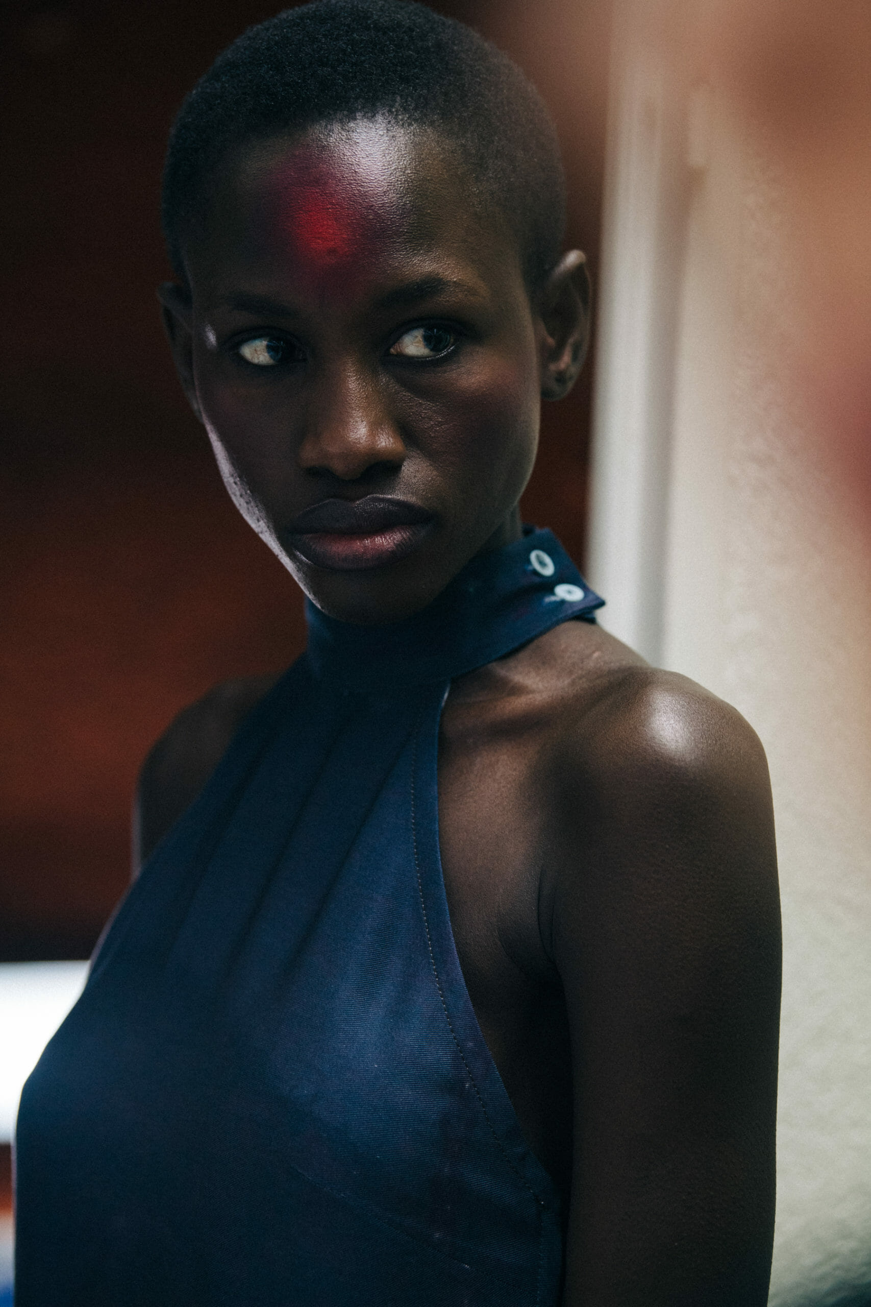 Model wearing dark blue dress