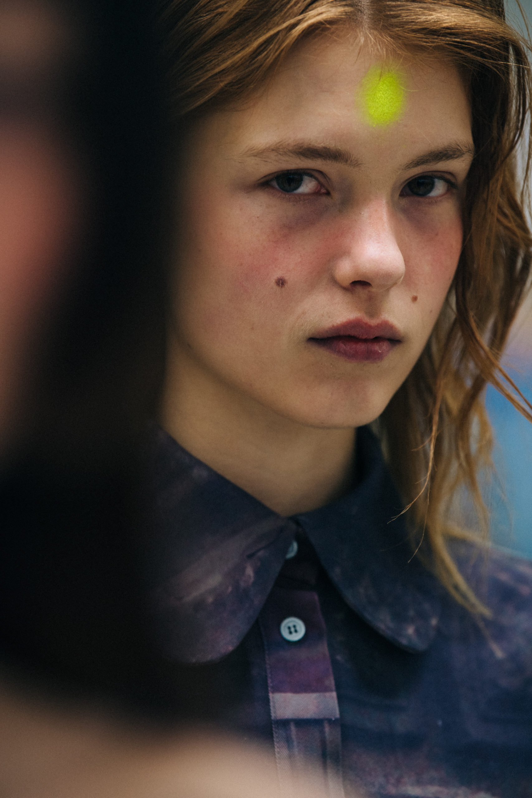 Models wearing lilac backstage
