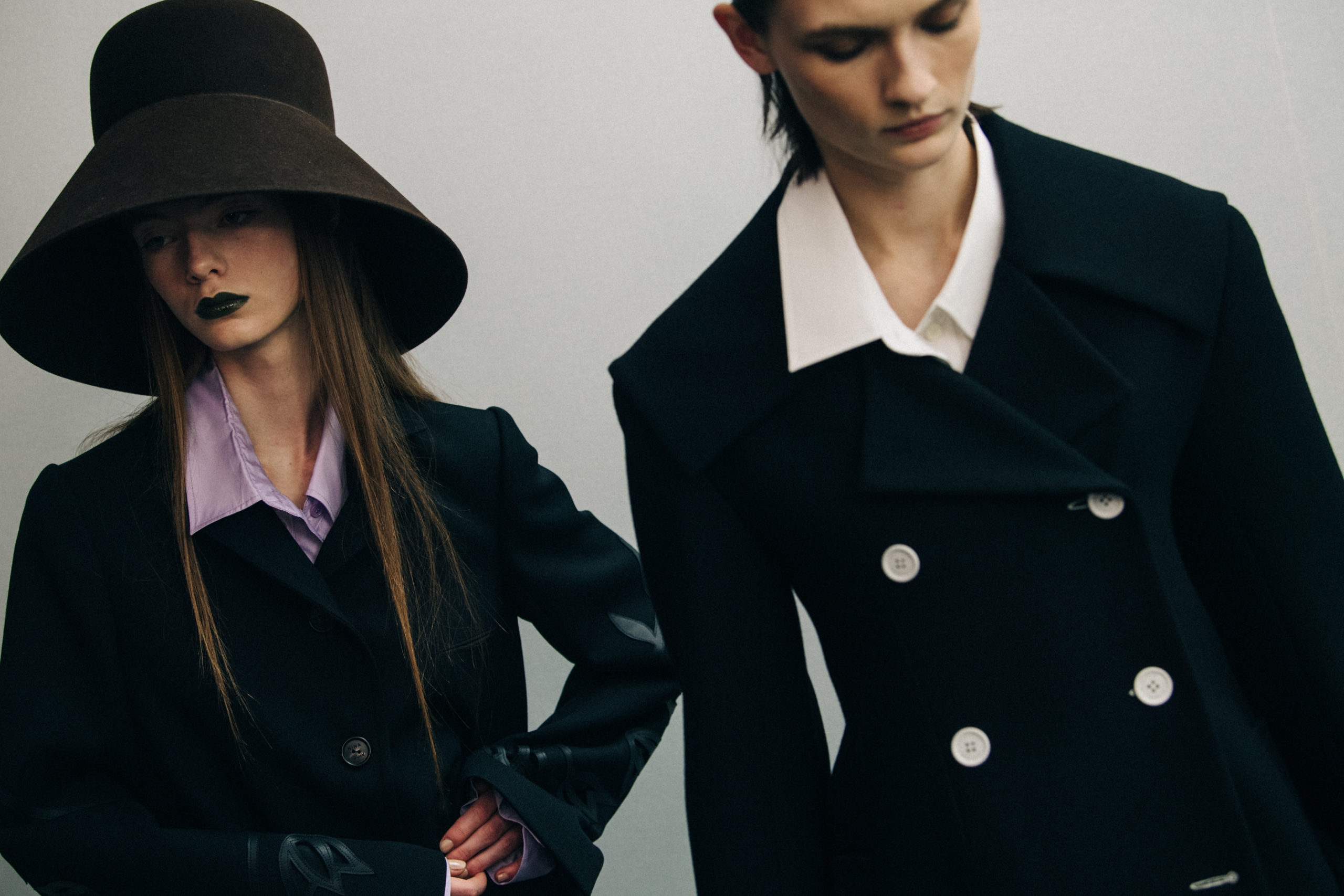 Model wearing large hat at Nina Ricci