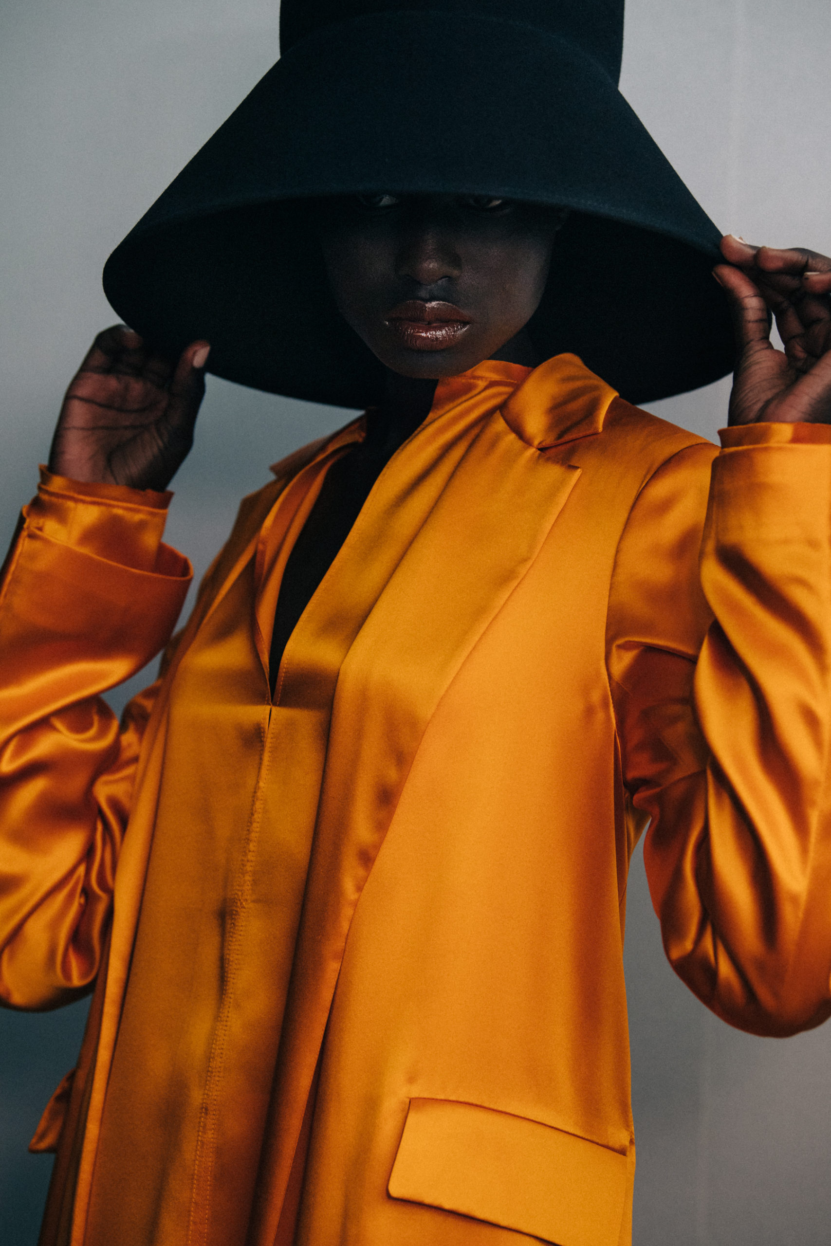 Model wearing large hat at Nina Ricci