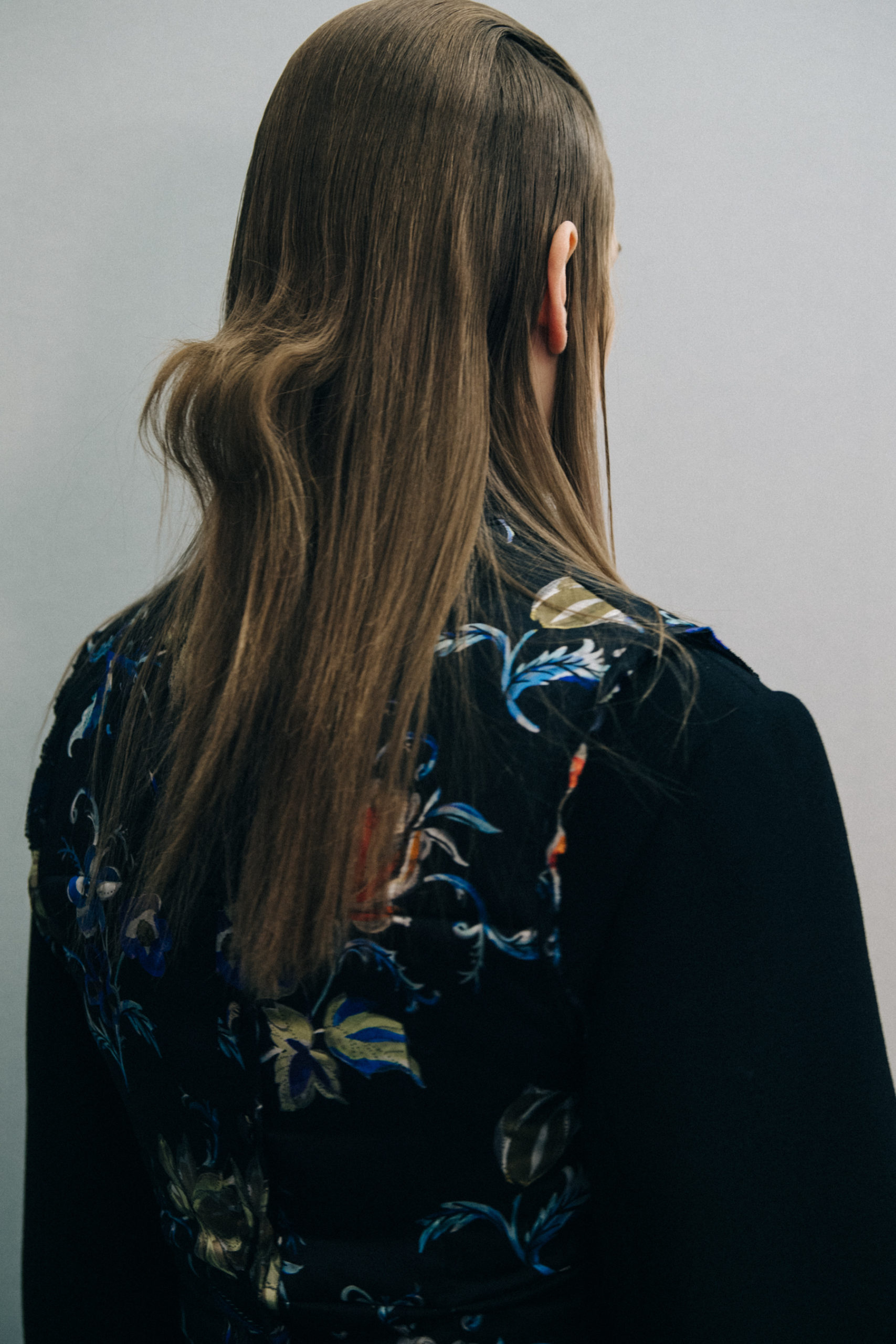 Model wearing dark coat at Nina Ricci