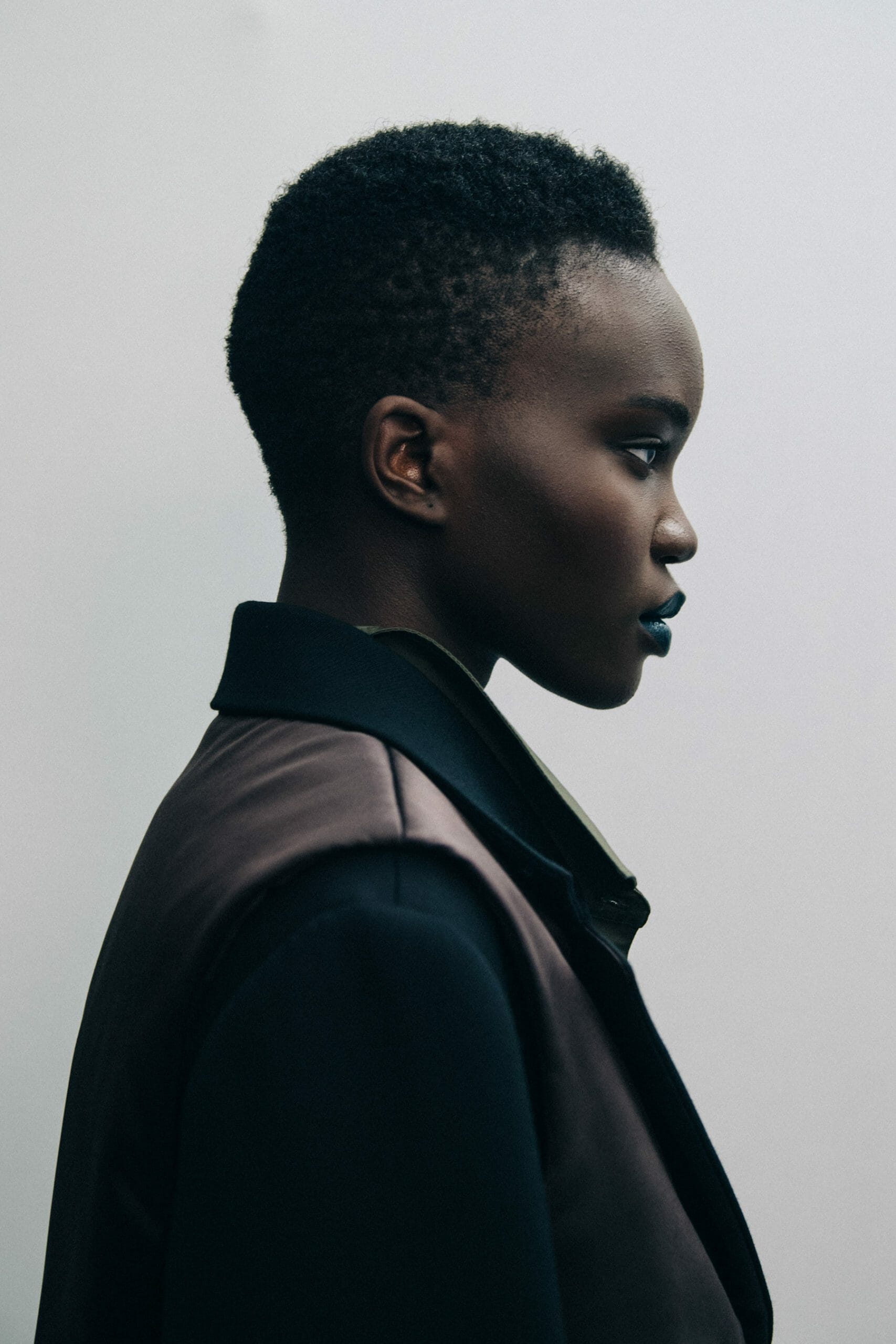 Model wearing dark coat at Nina Ricci