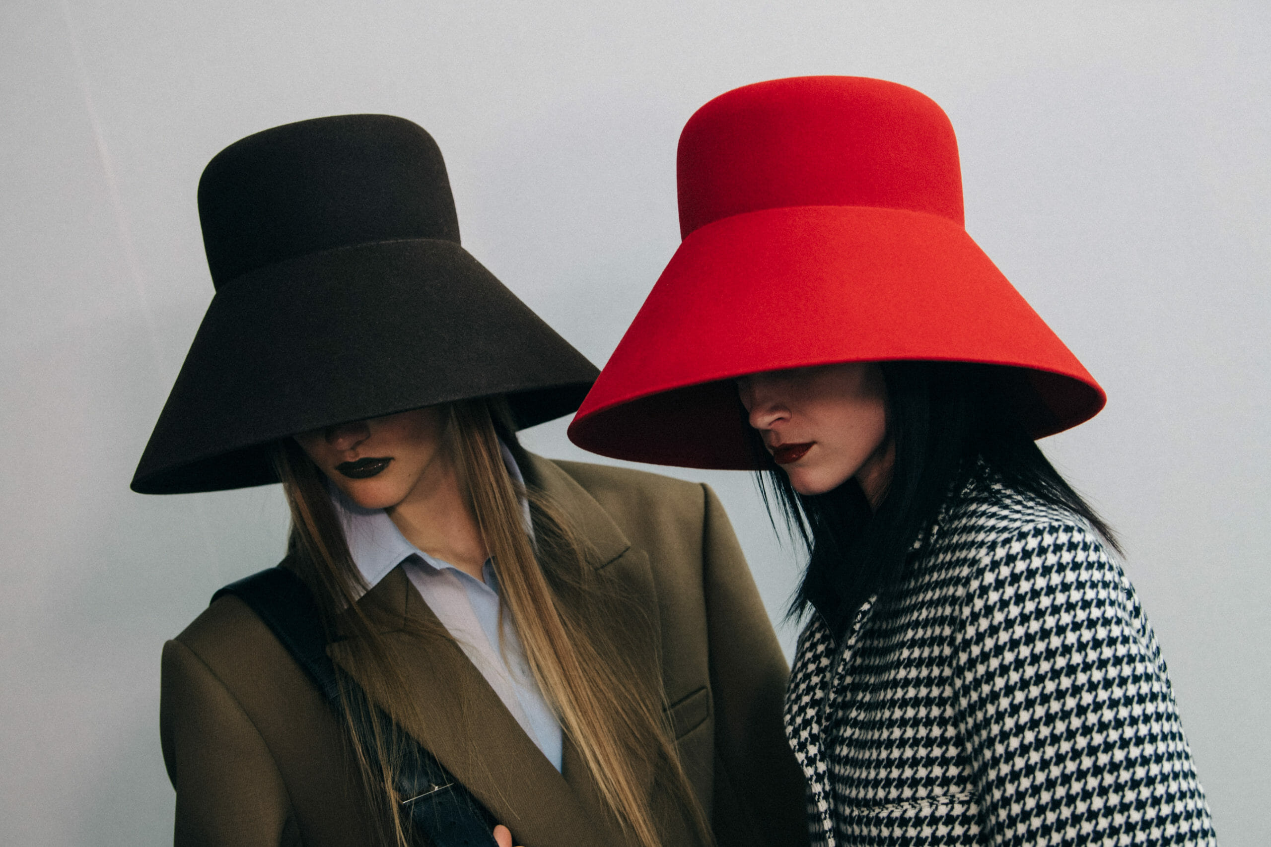 Model wearing large hat at Nina Ricci