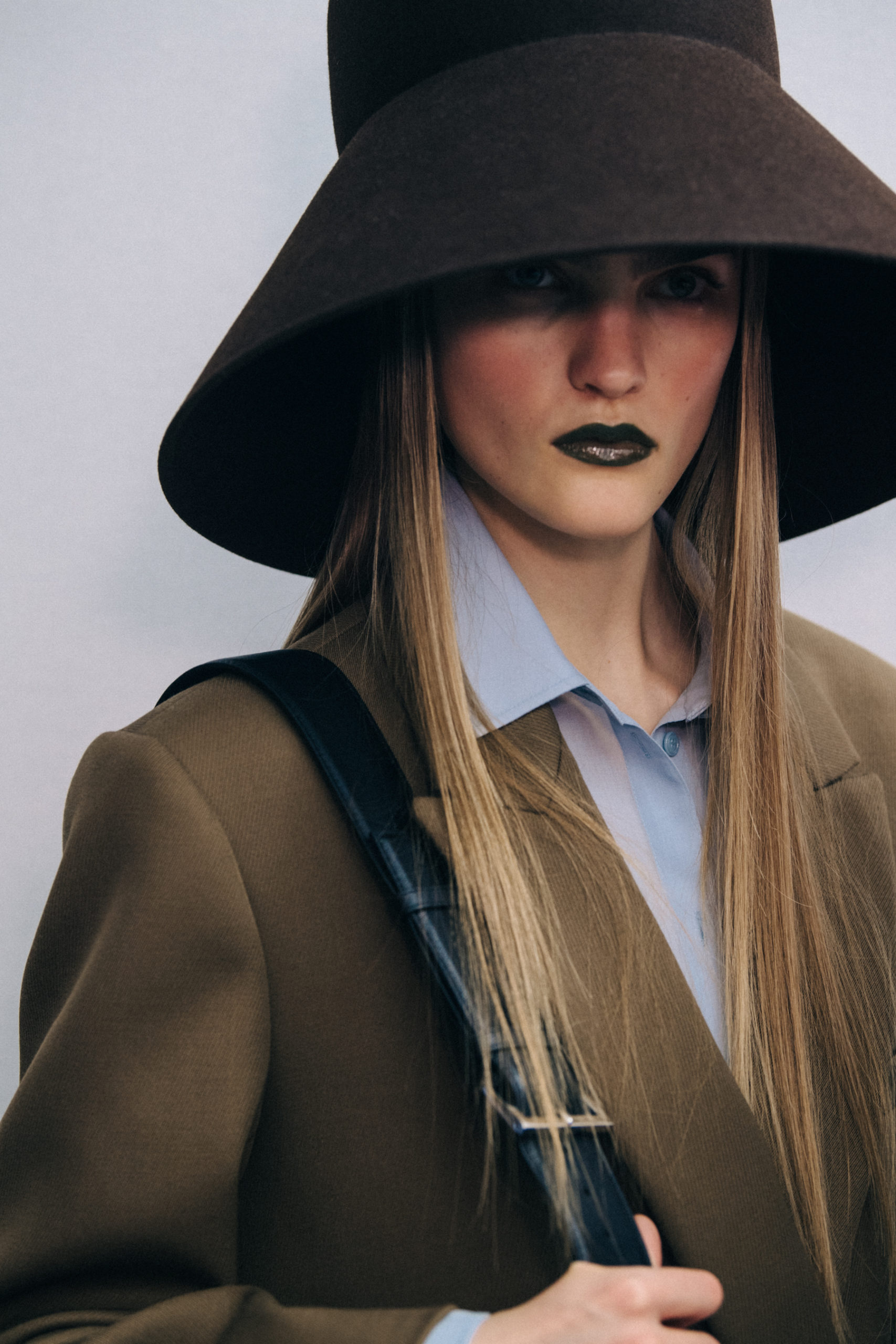 Model wearing large hat at Nina Ricci