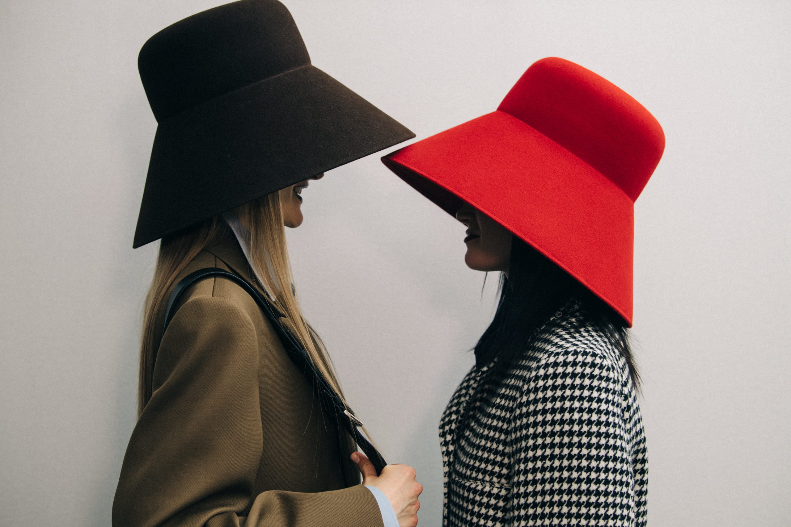 Model wearing large hat at Nina Ricci