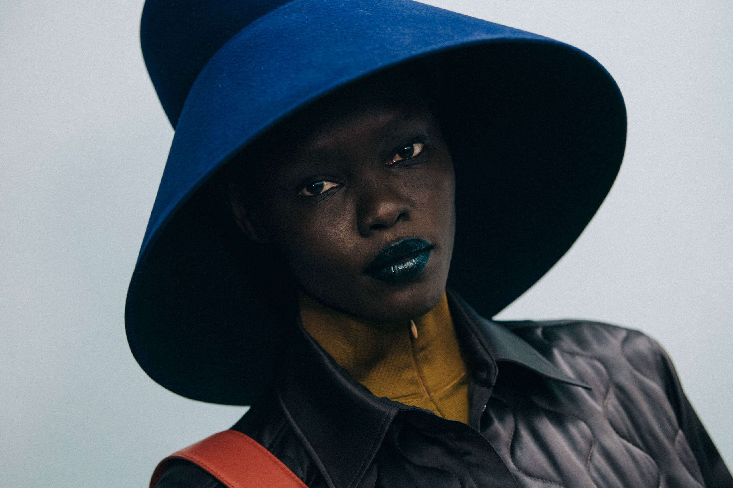 Model wearing large hat at Nina Ricci