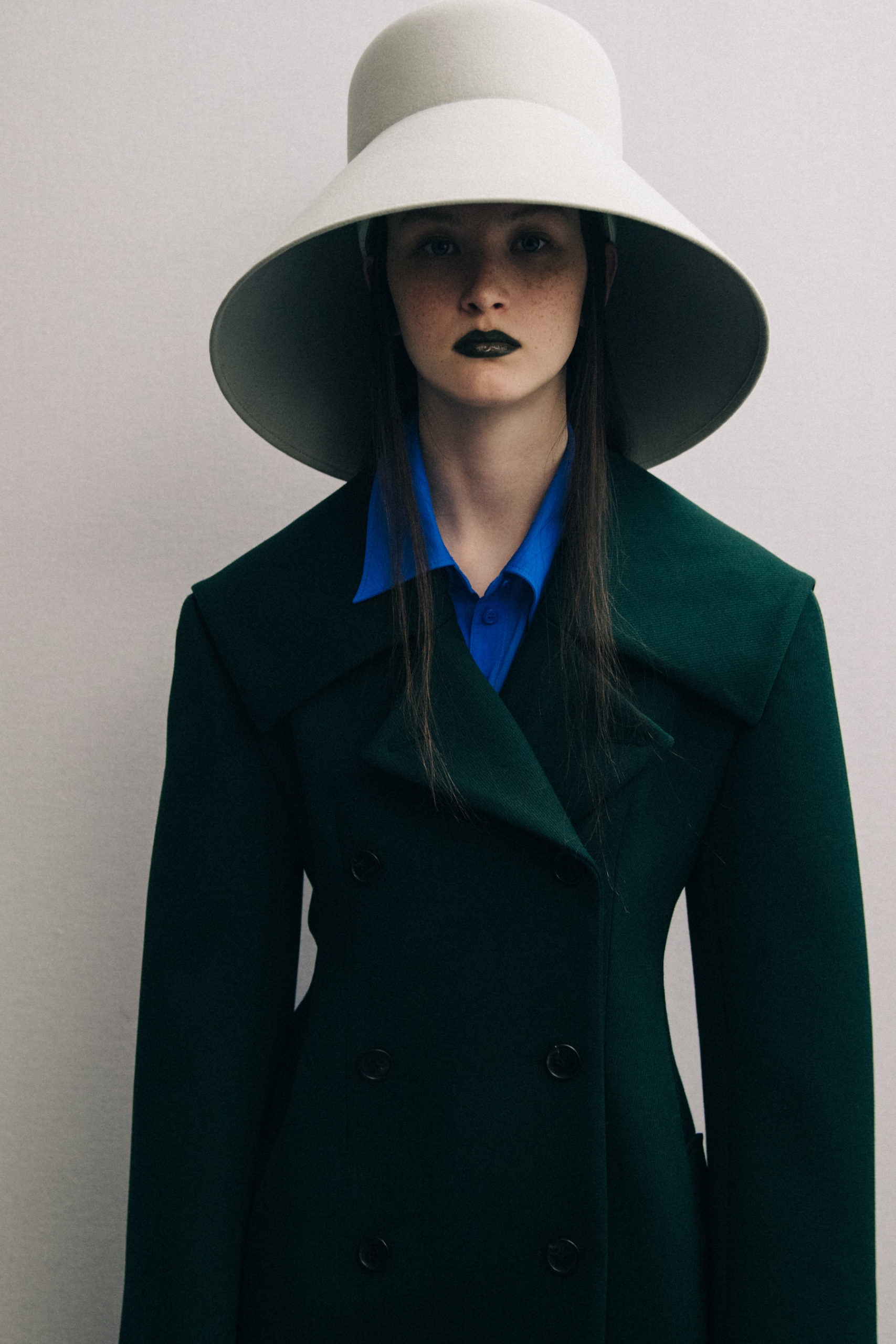 Model wearing large hat at Nina Ricci