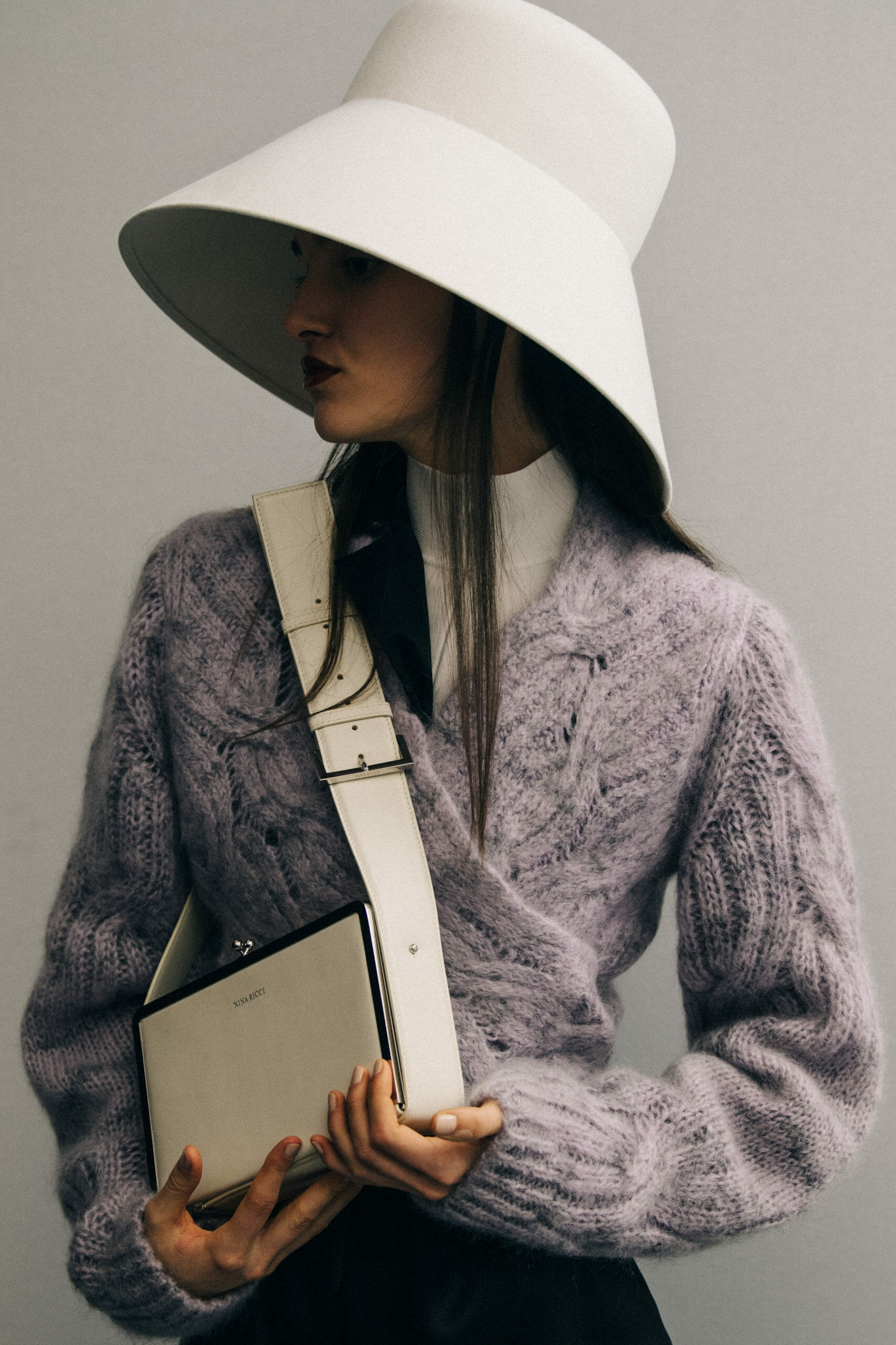 Model wearing large hat at Nina Ricci