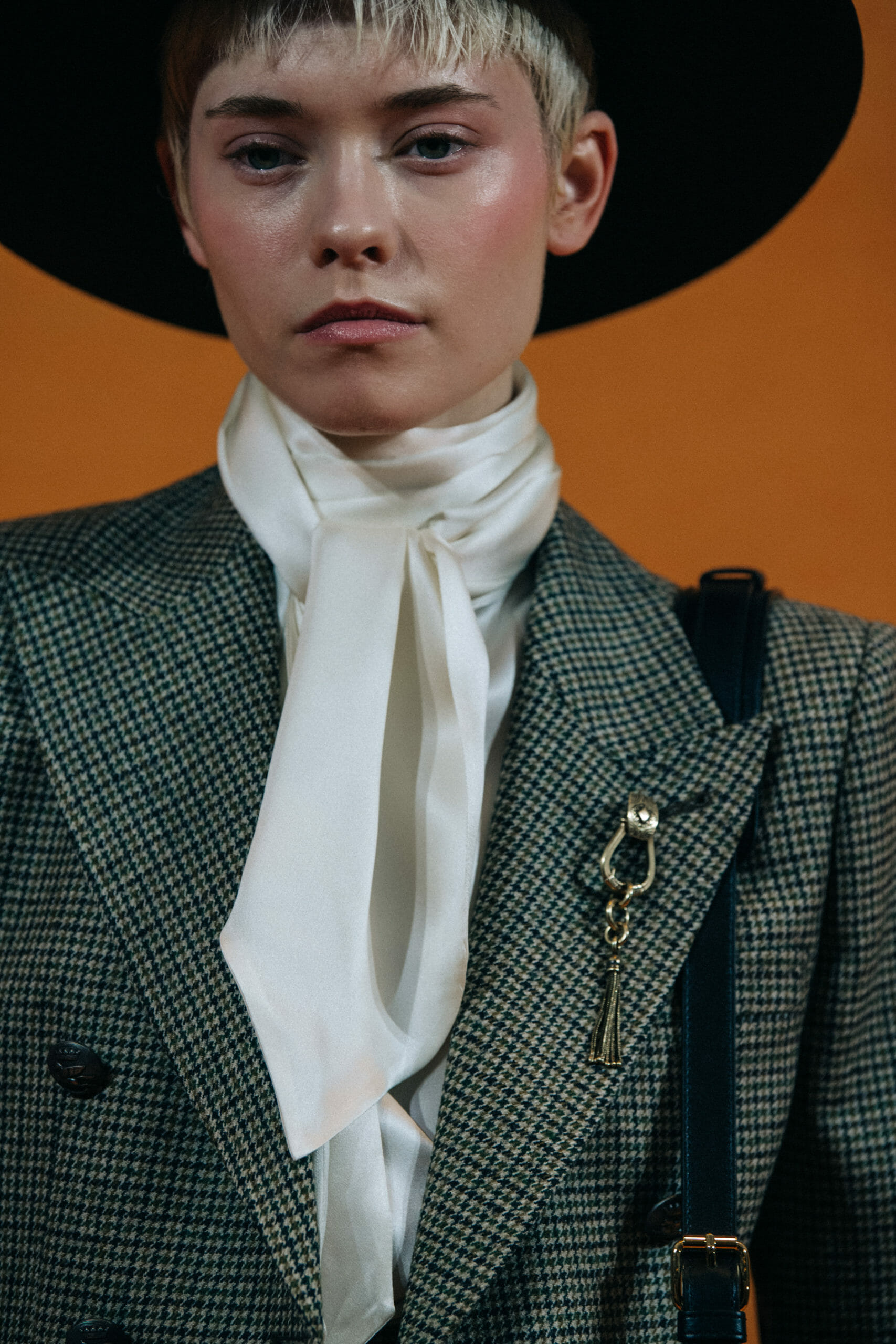 Model wearing white scarf