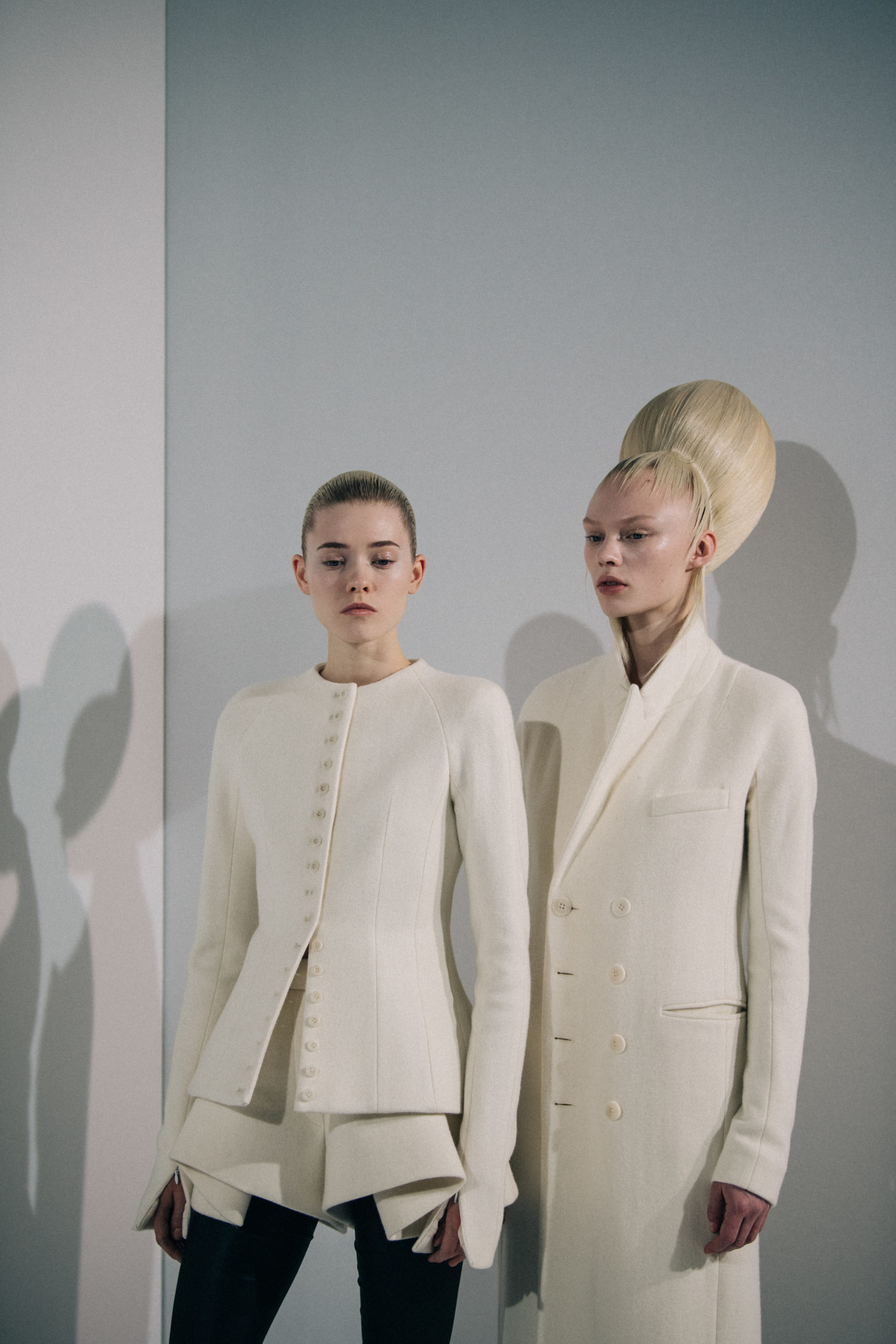 Model wearing white Haider Ackermann coat