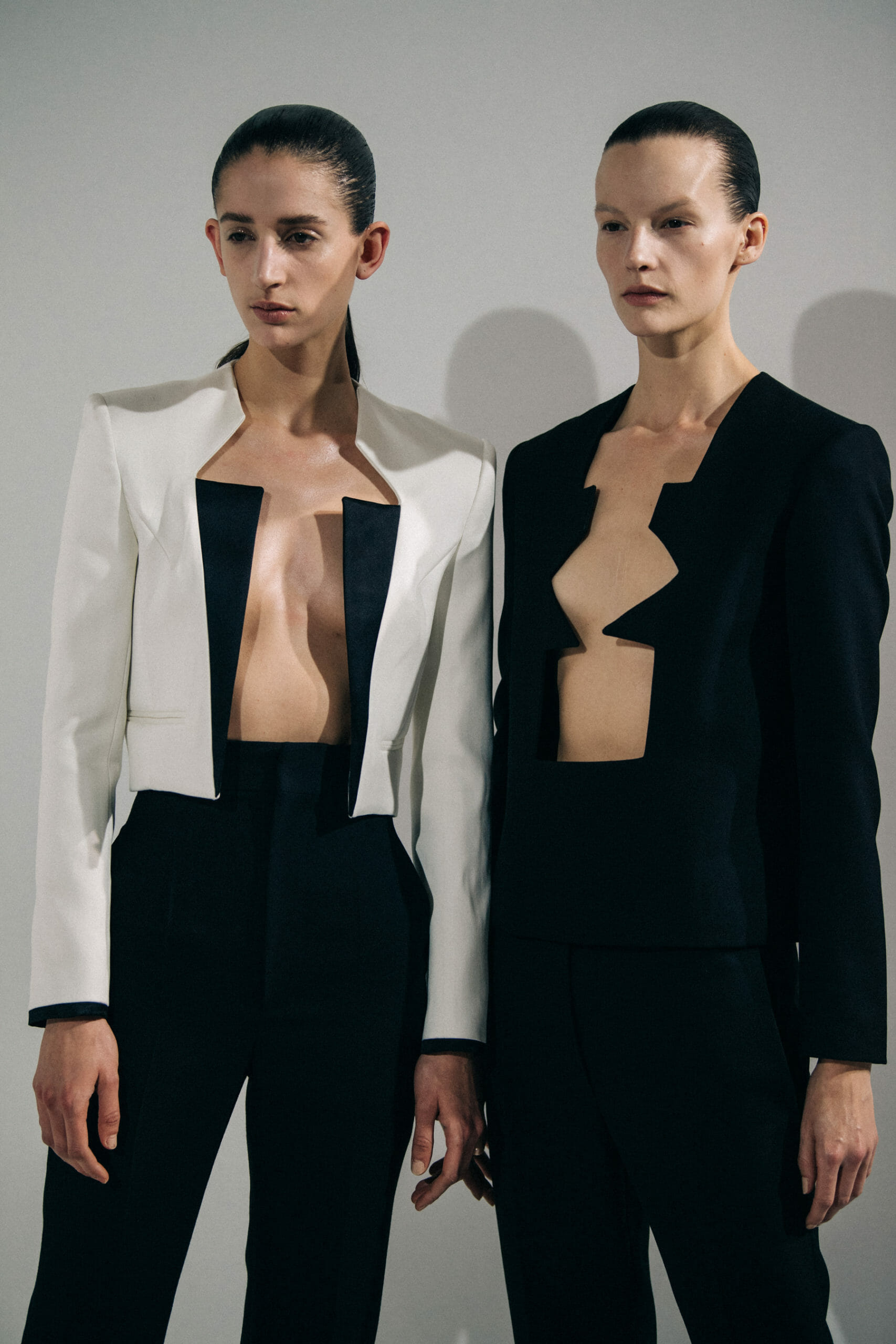 Models wearing black and white at Haider Ackermann