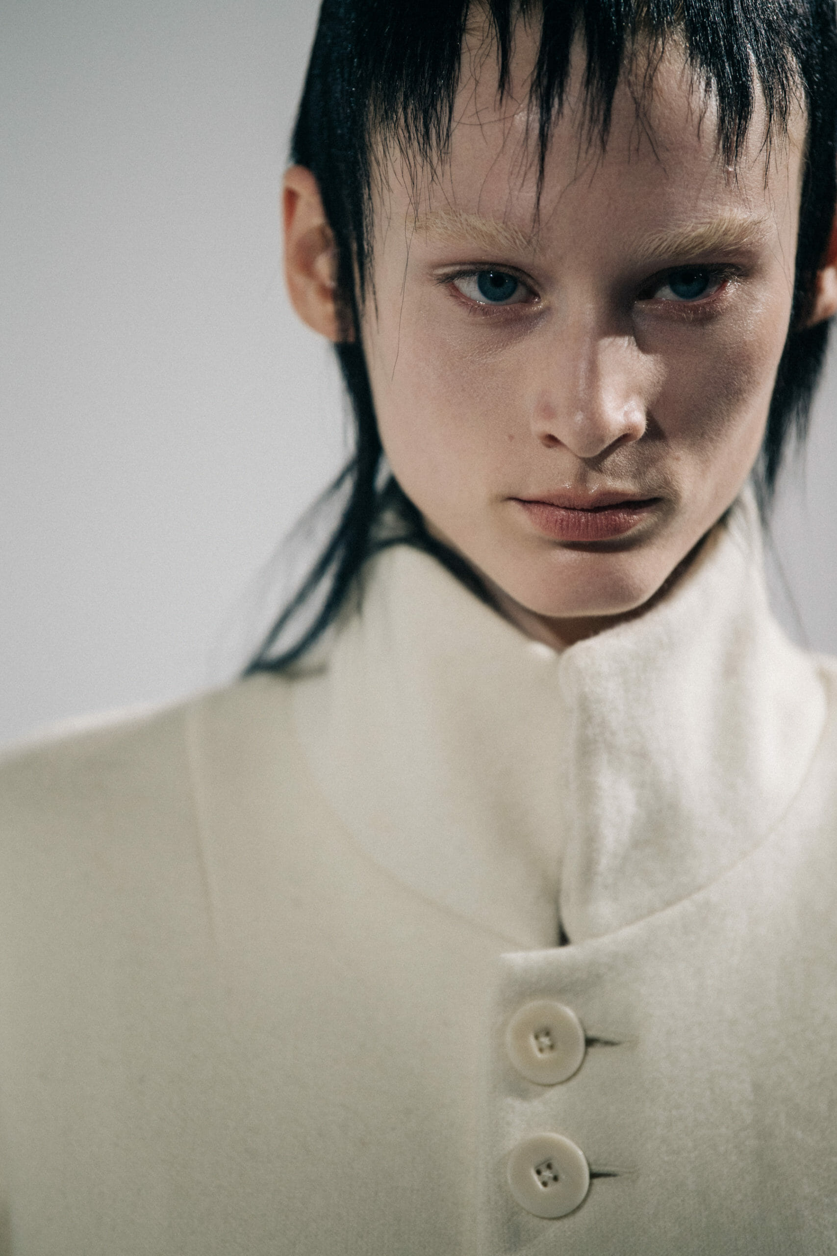 Model wearing white Haider Ackermann coat