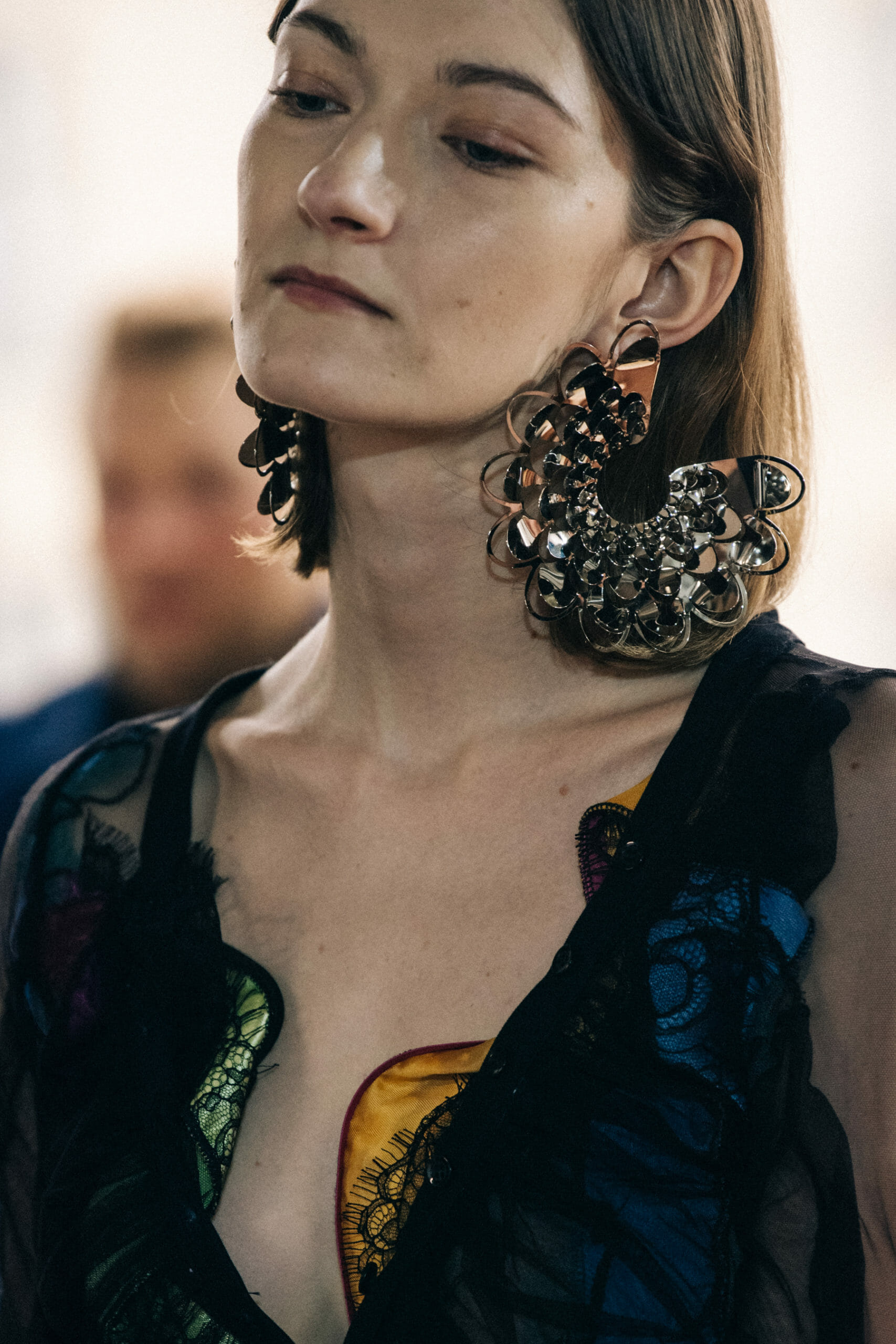 Models wearing large earrings at Y Project