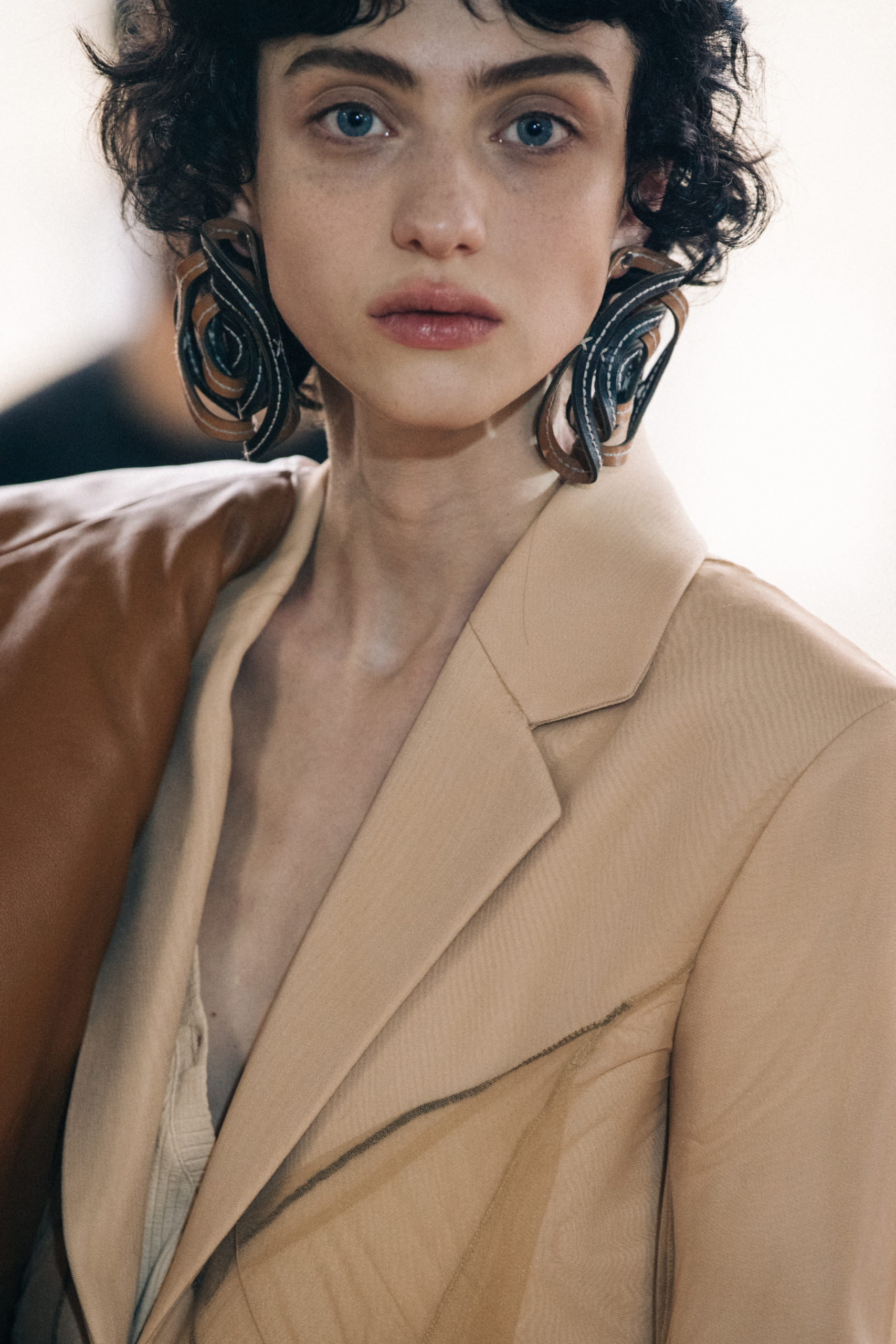 Models wearing large earrings at Y Project