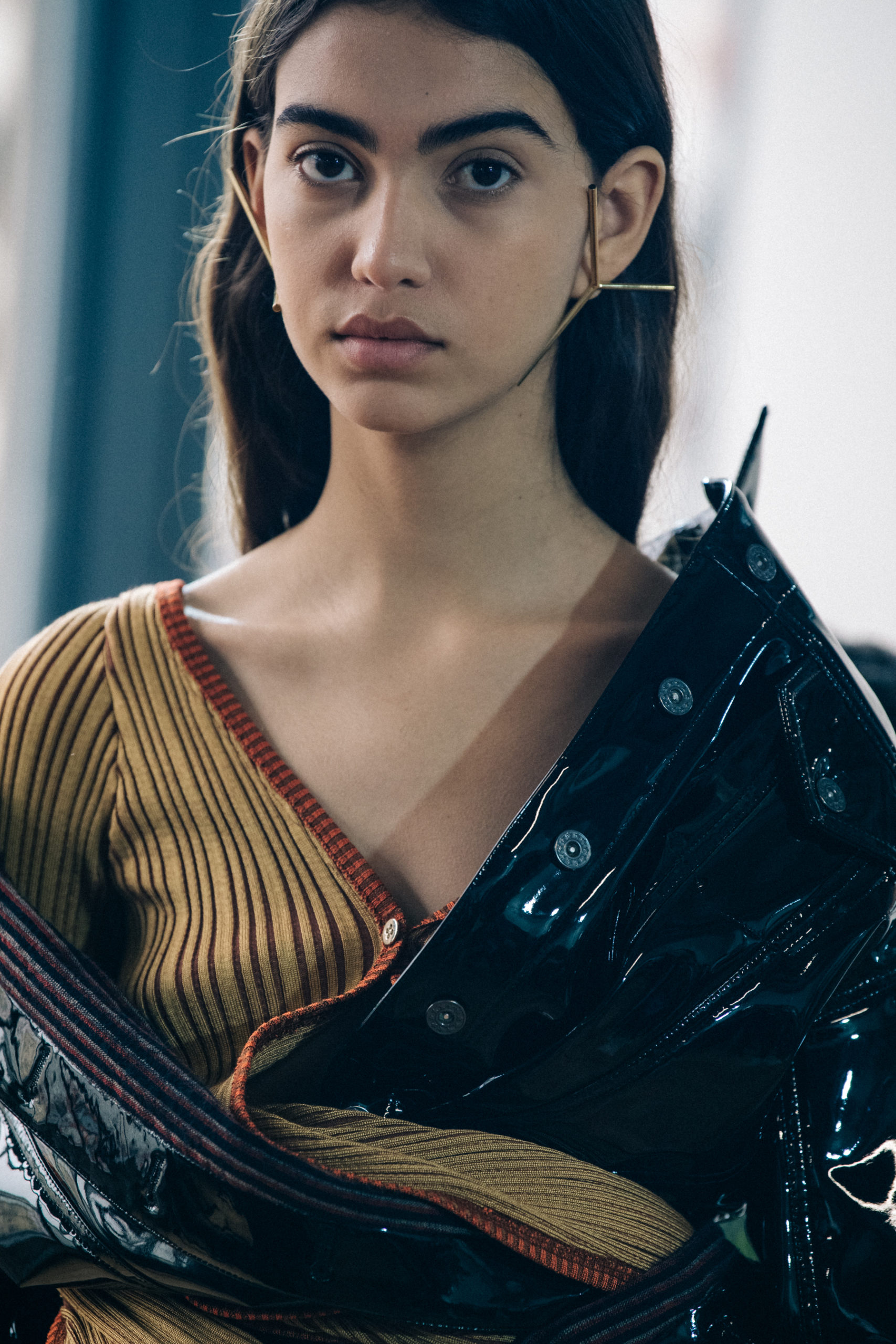 Models wearing large earrings at Y Project