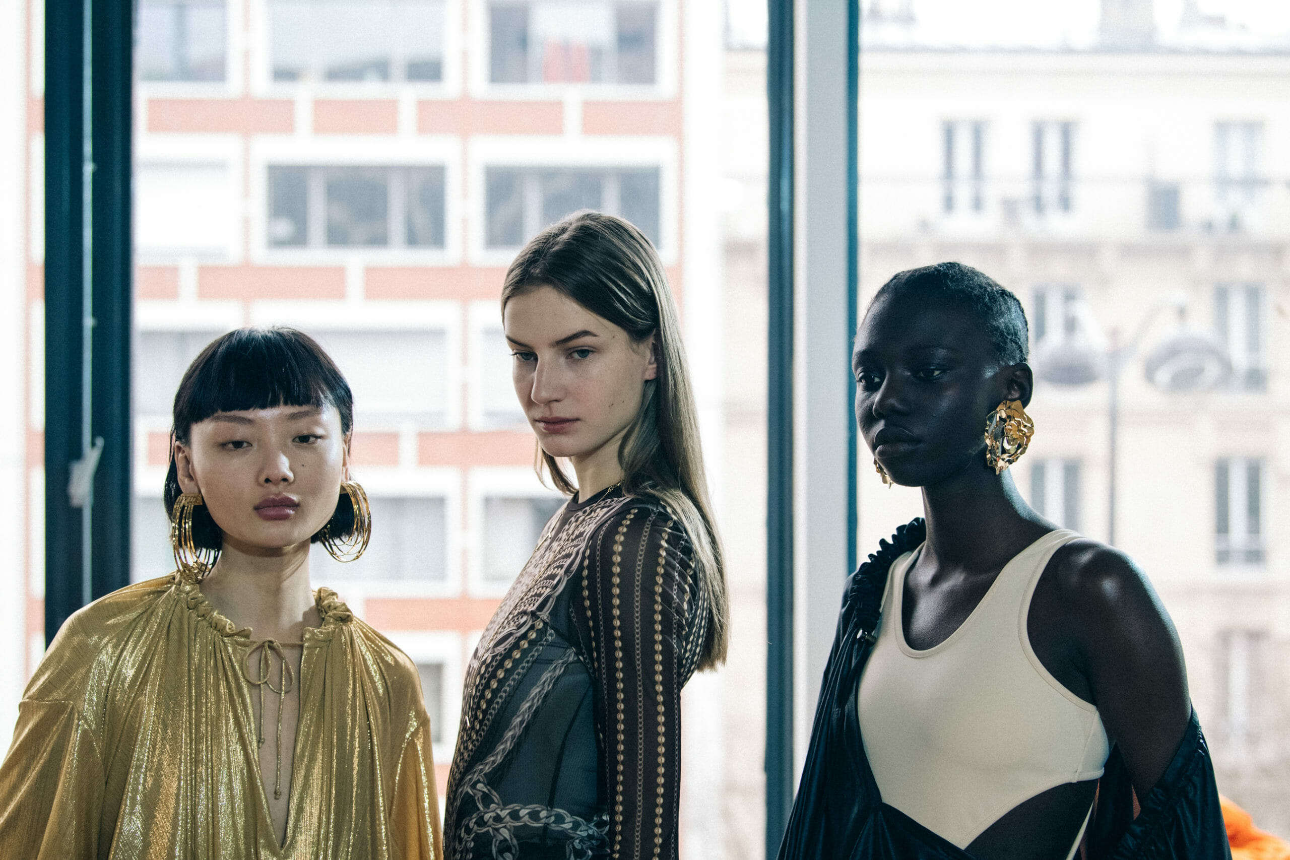 Models wearing large earrings at Y Project