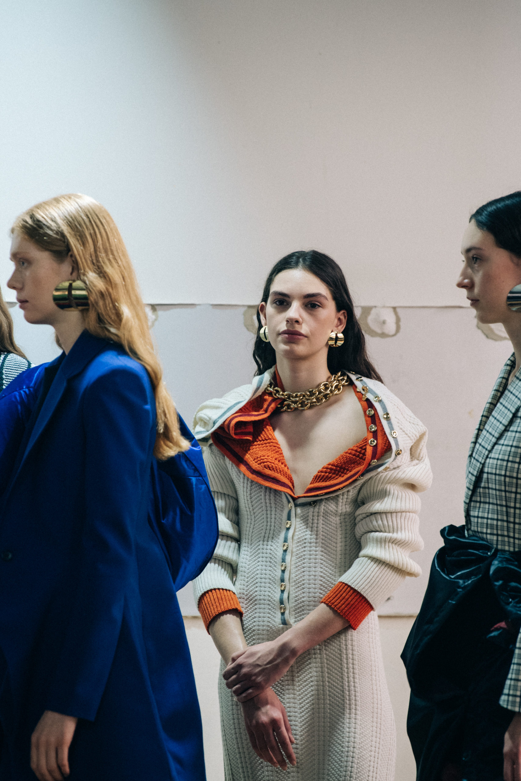 Models wearing large earrings at Y Project