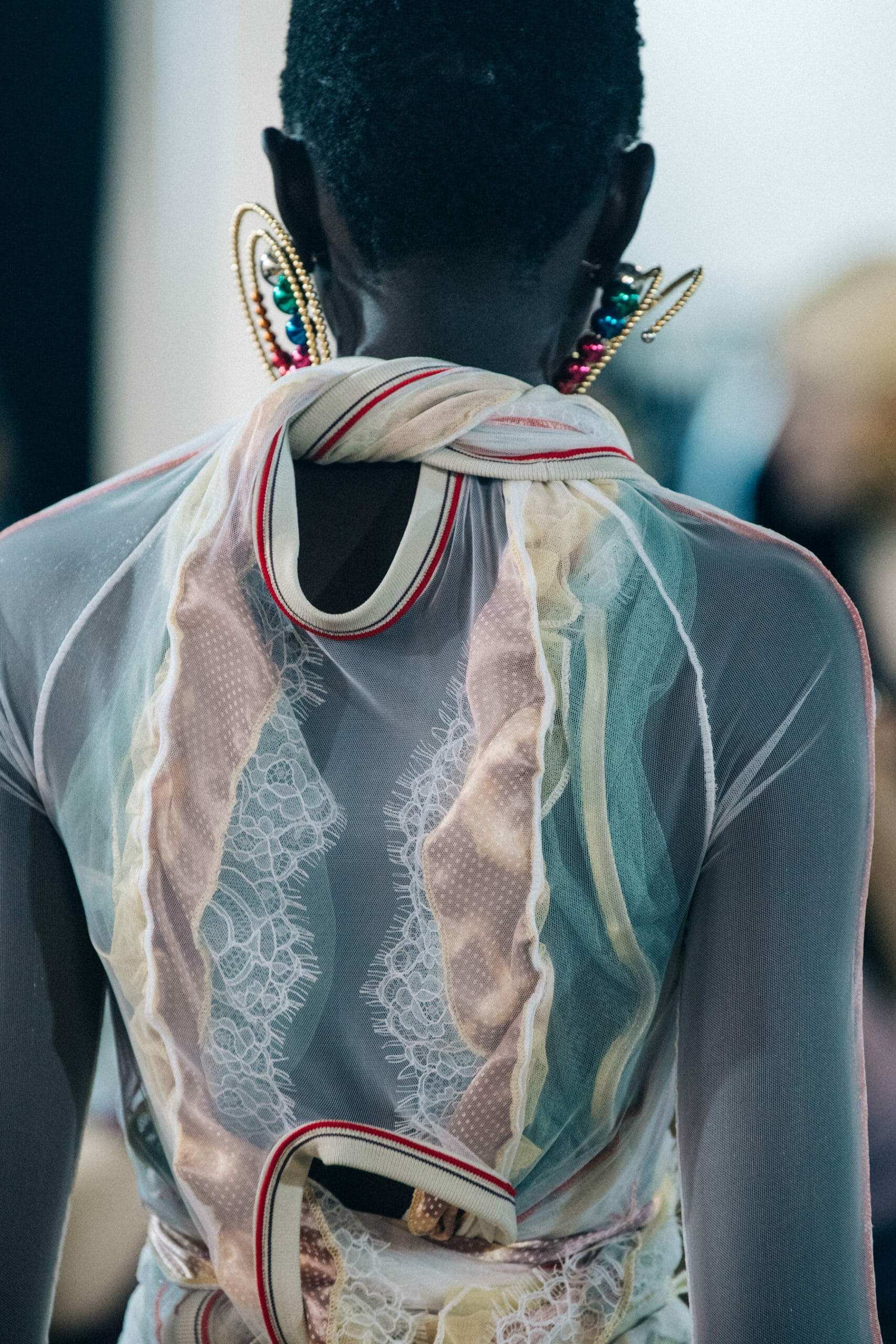 Models wearing large earrings at Y Project