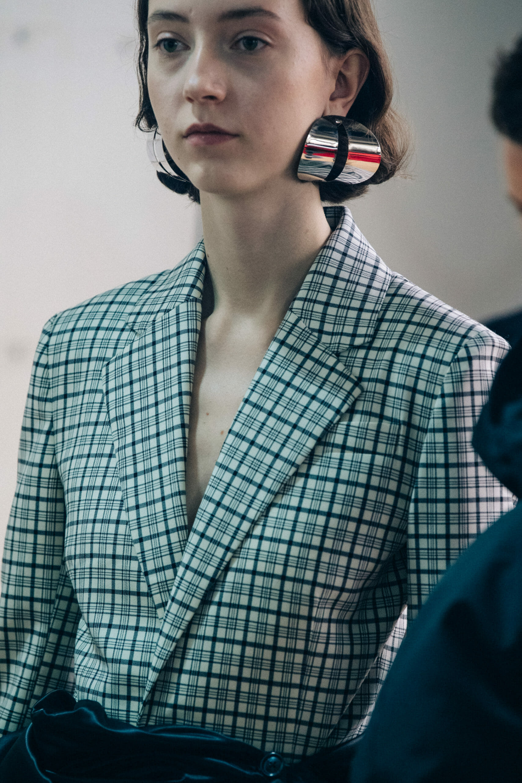 Models wearing large earrings at Y Project