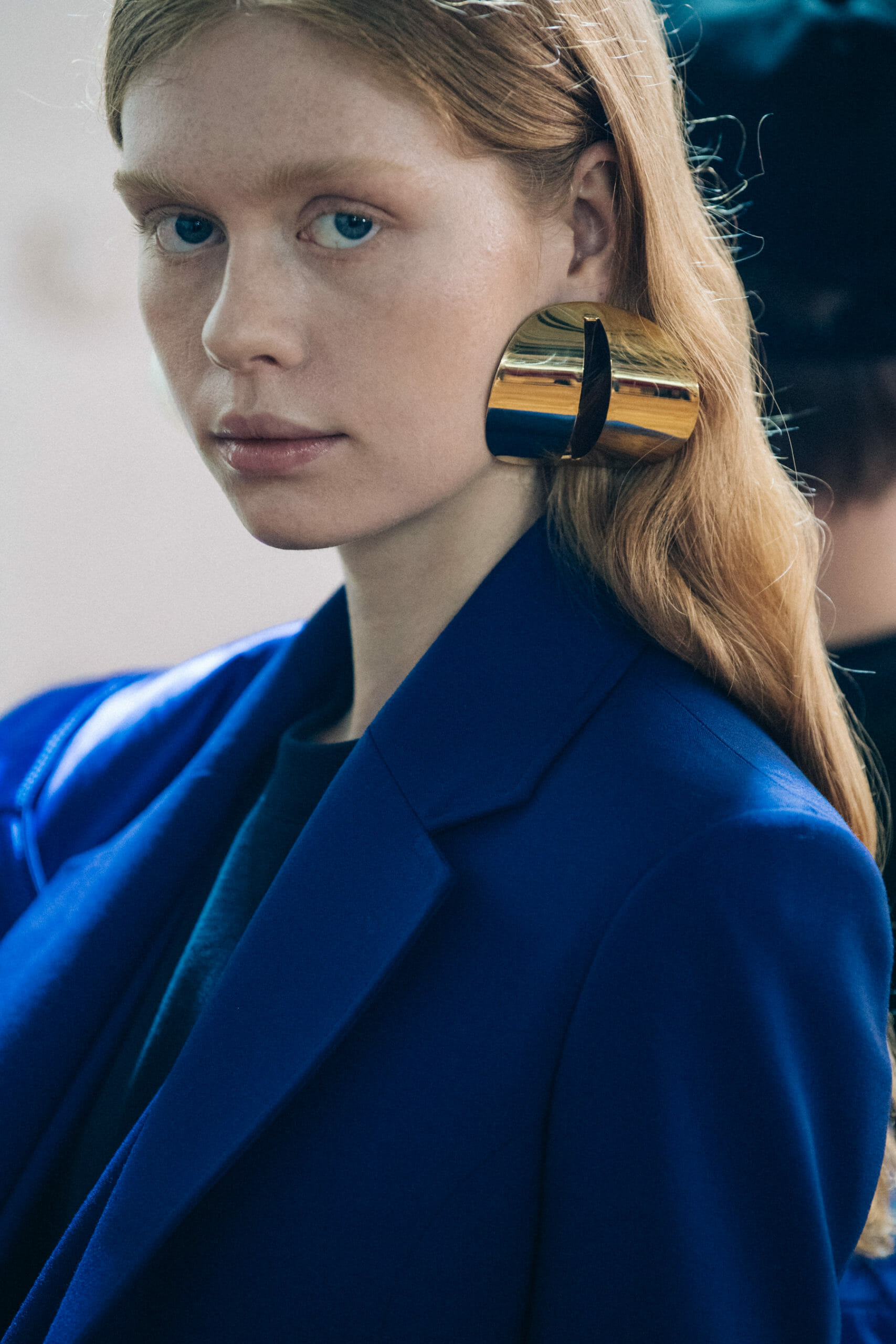 Models wearing large earrings at Y Project