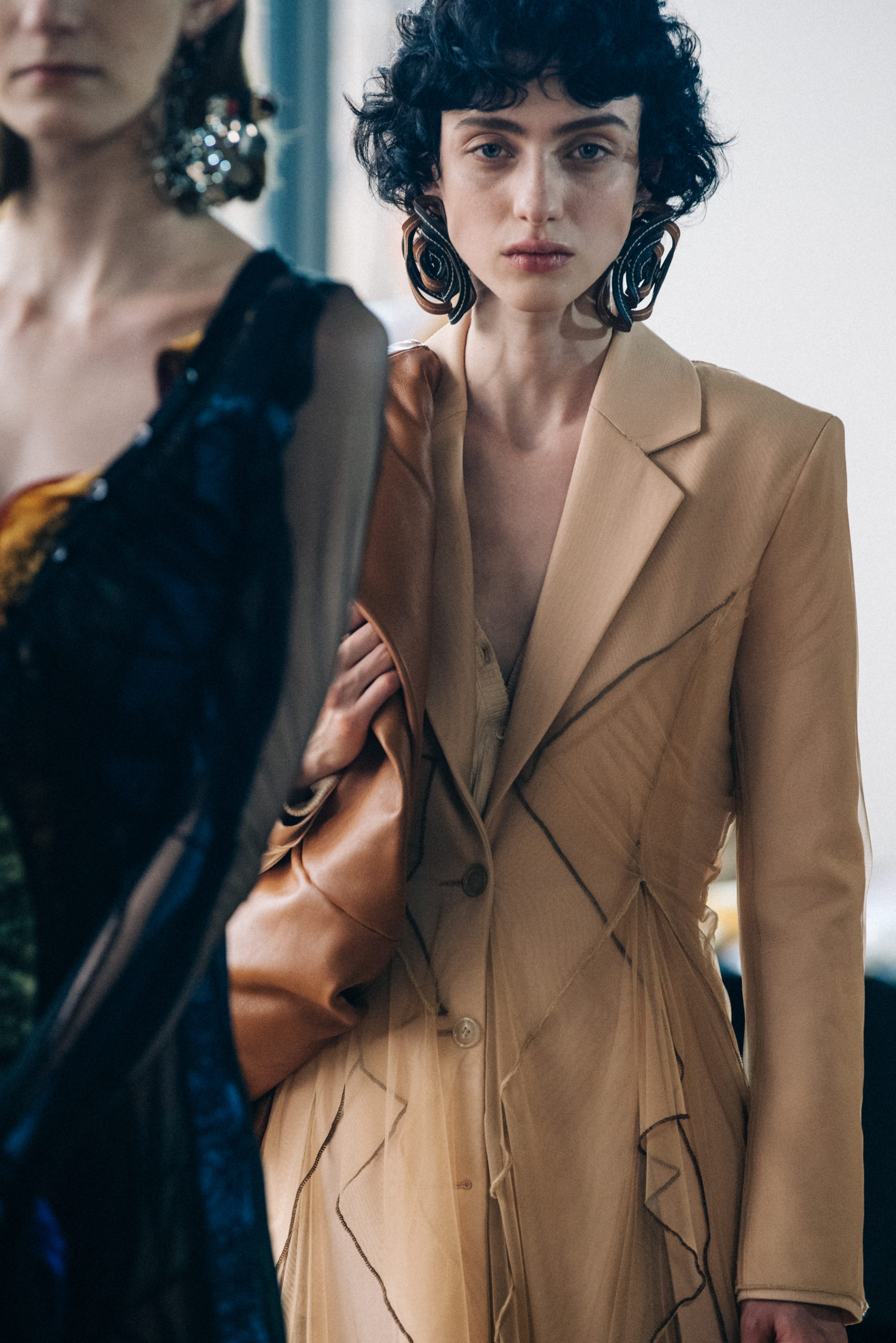 Models wearing large earrings at Y Project