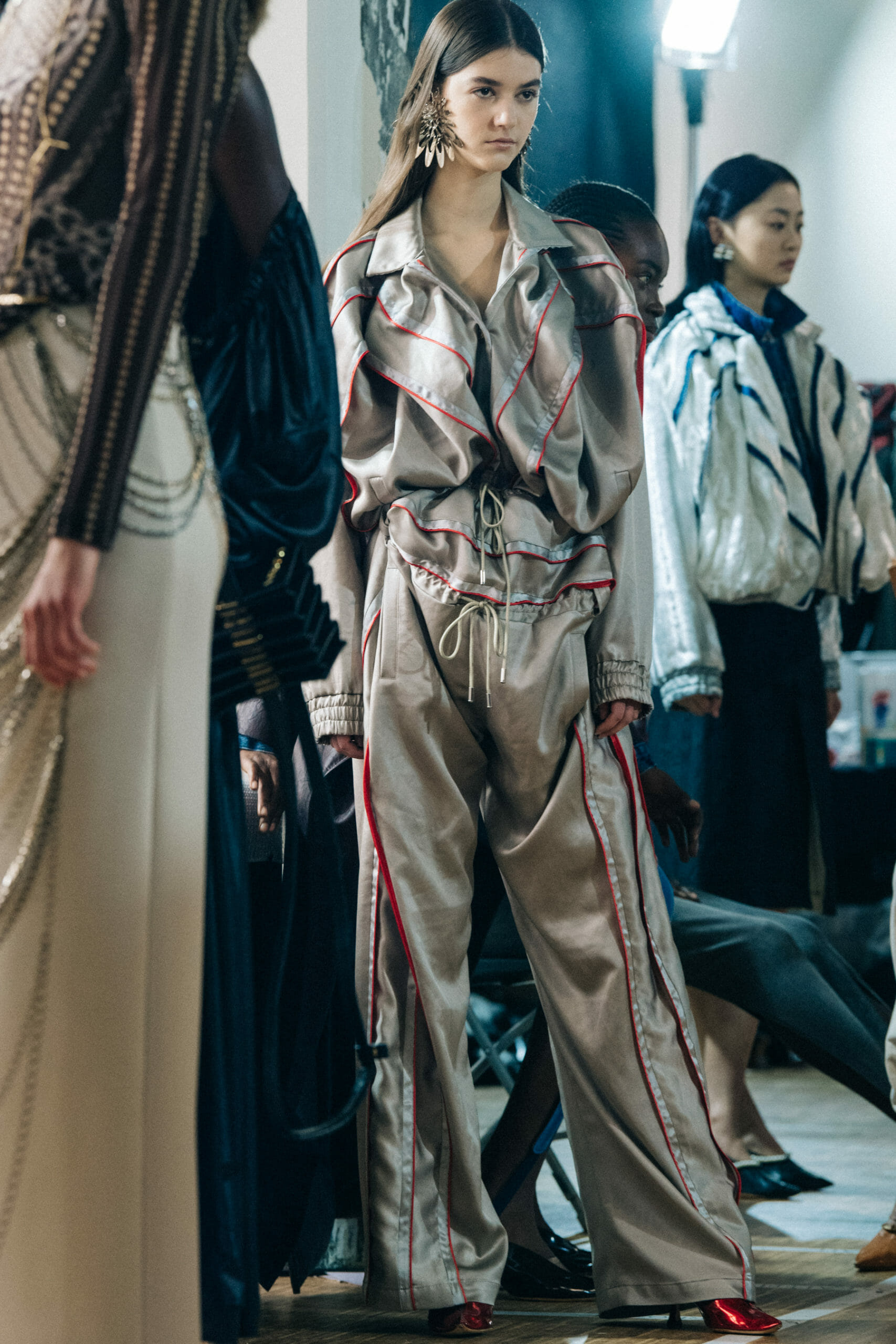 Models wearing large earrings at Y Project