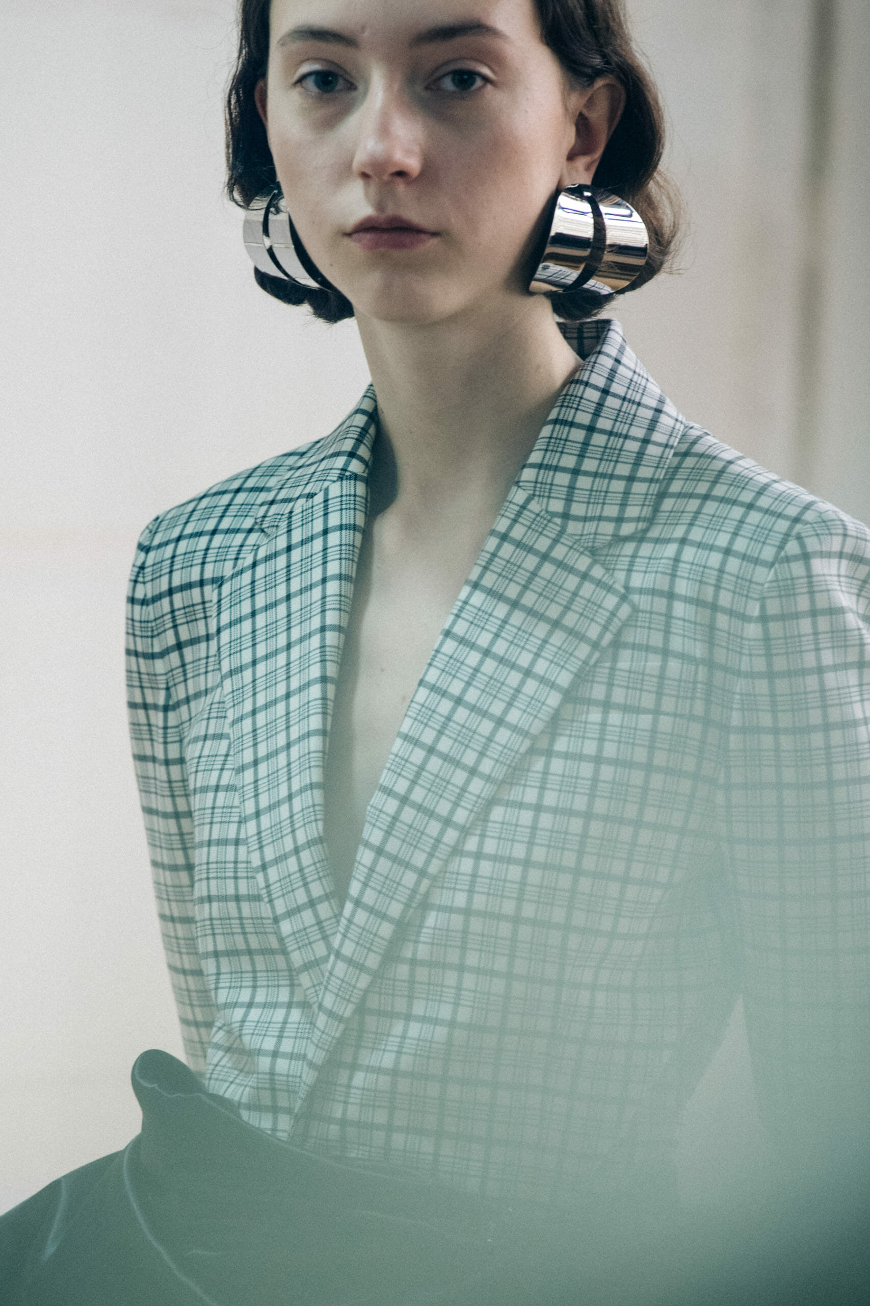 Models wearing large earrings at Y Project