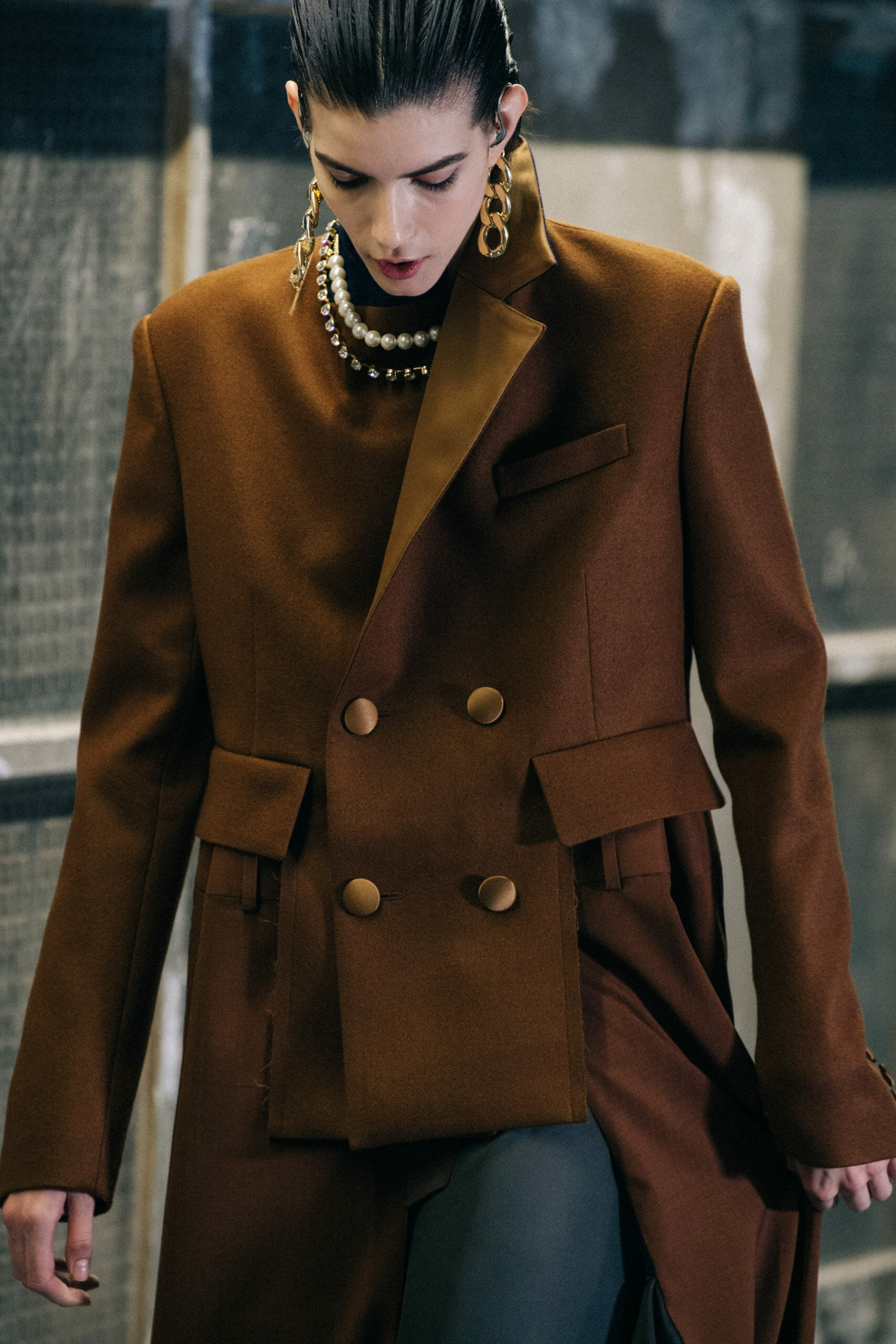 Model wearing brown at Sacai