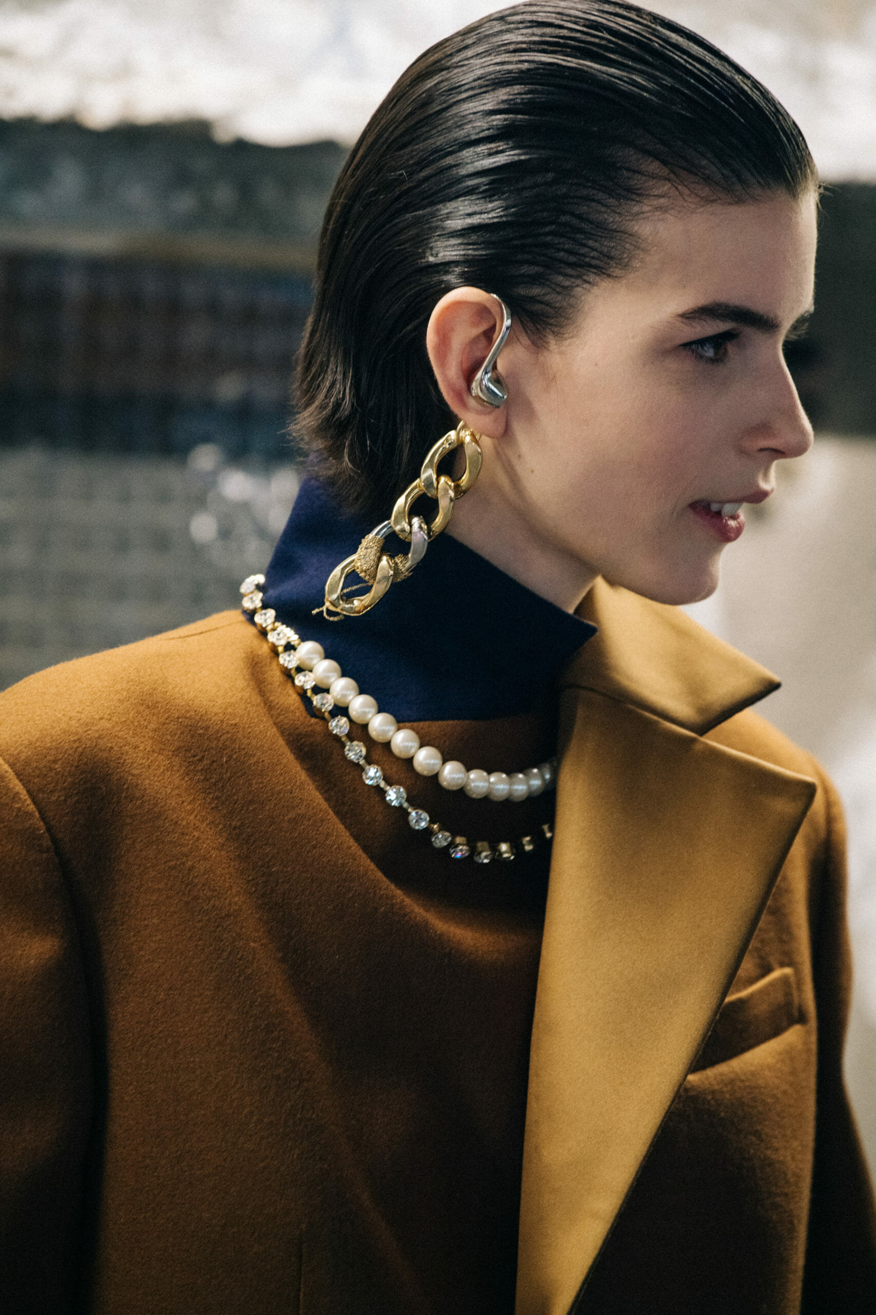 Model wearing brown at Sacai