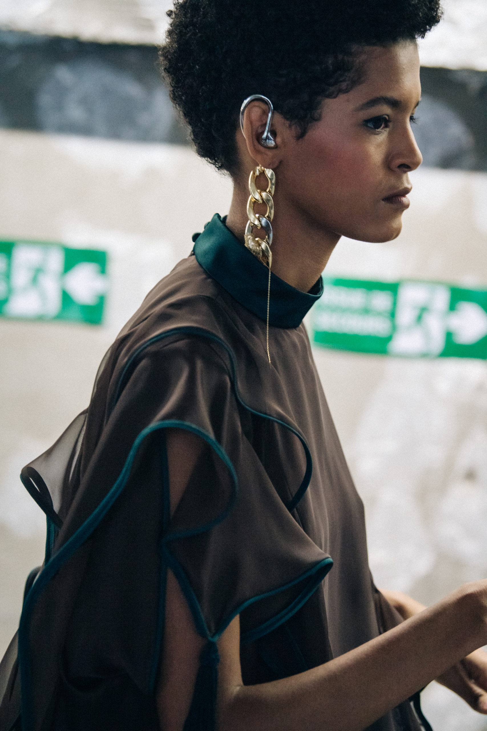 Model wearing brown at Sacai