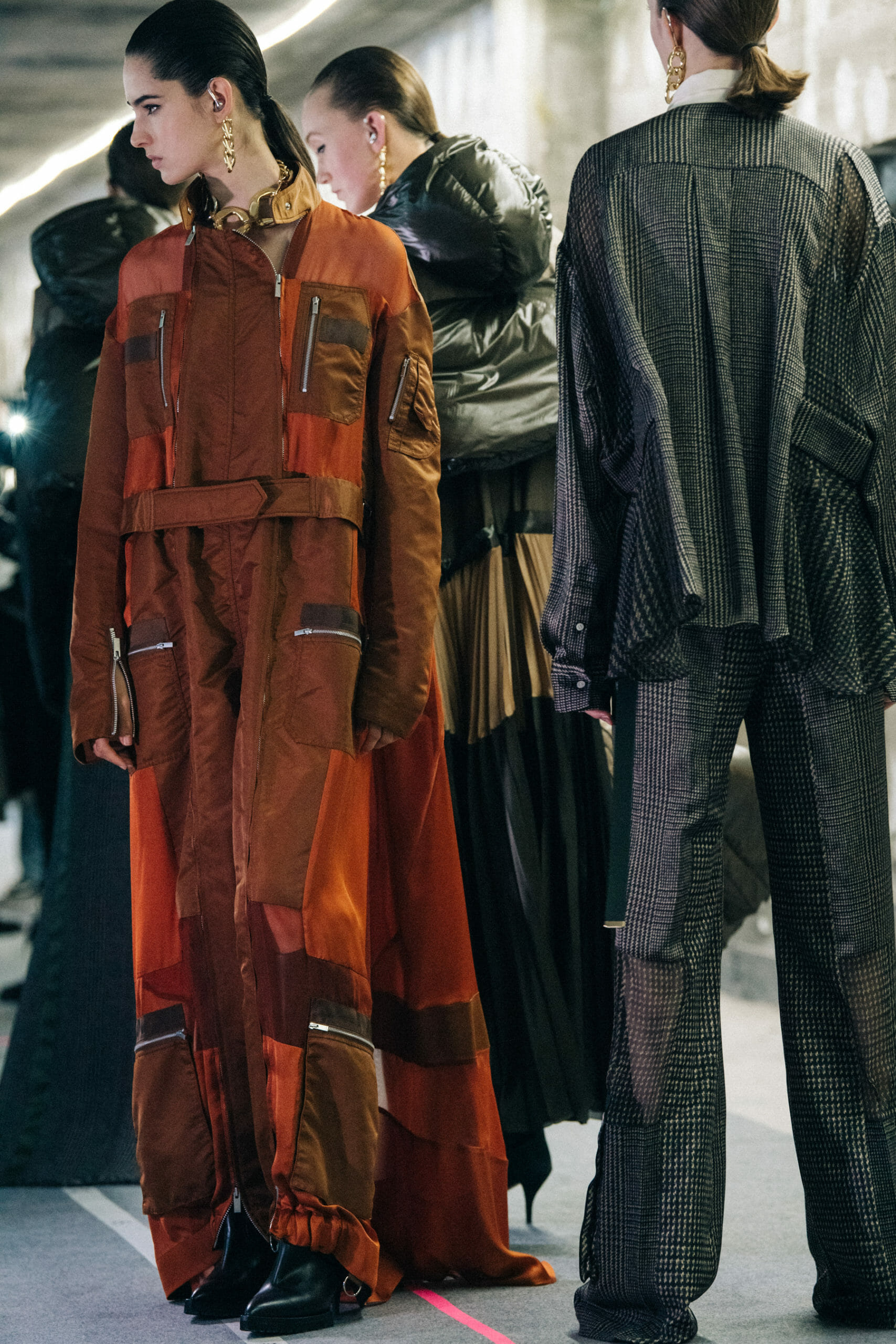 Model wearing brown at Sacai