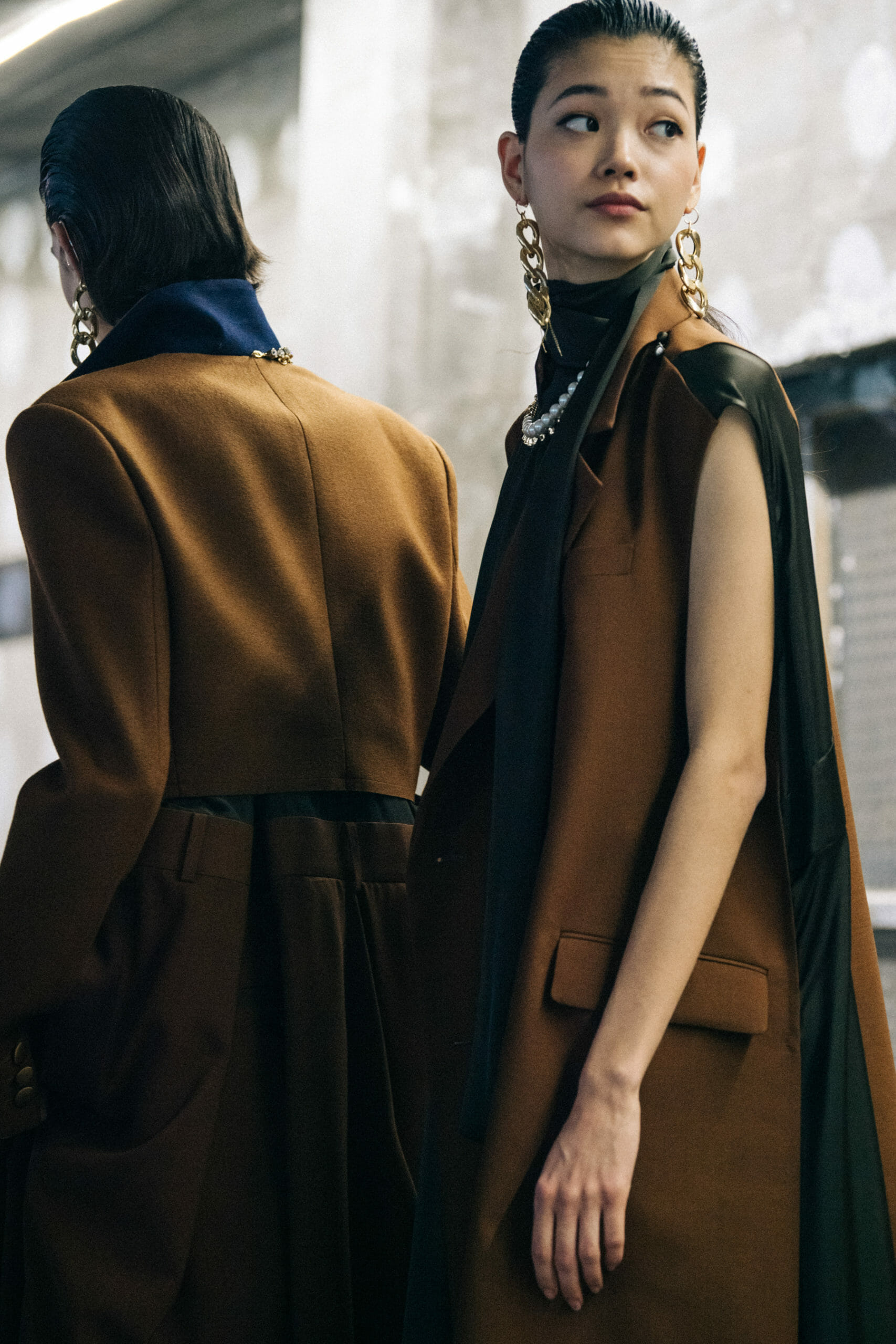 Model wearing brown at Sacai