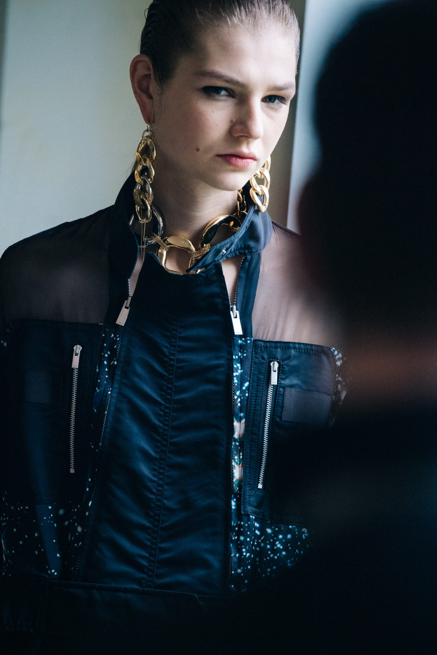 Model wearing black at Sacai