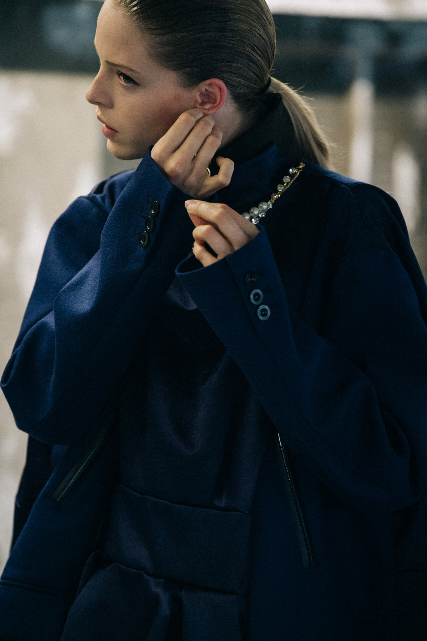 Model wearing brown at Sacai