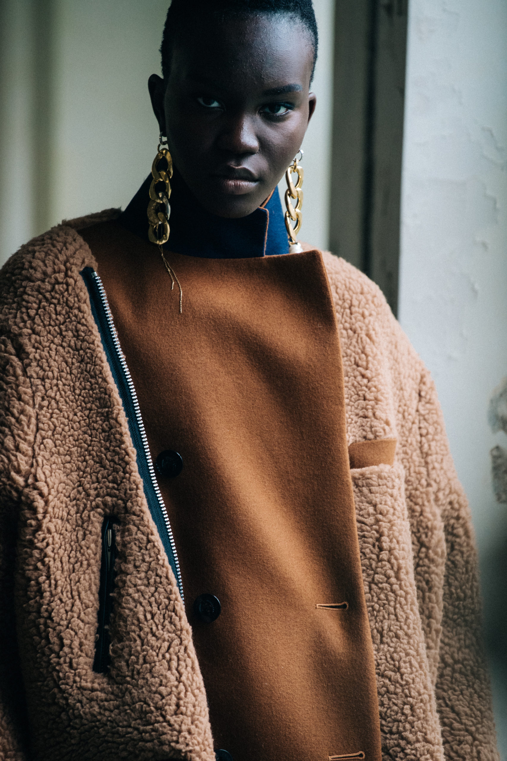 Model wearing brown at Sacai