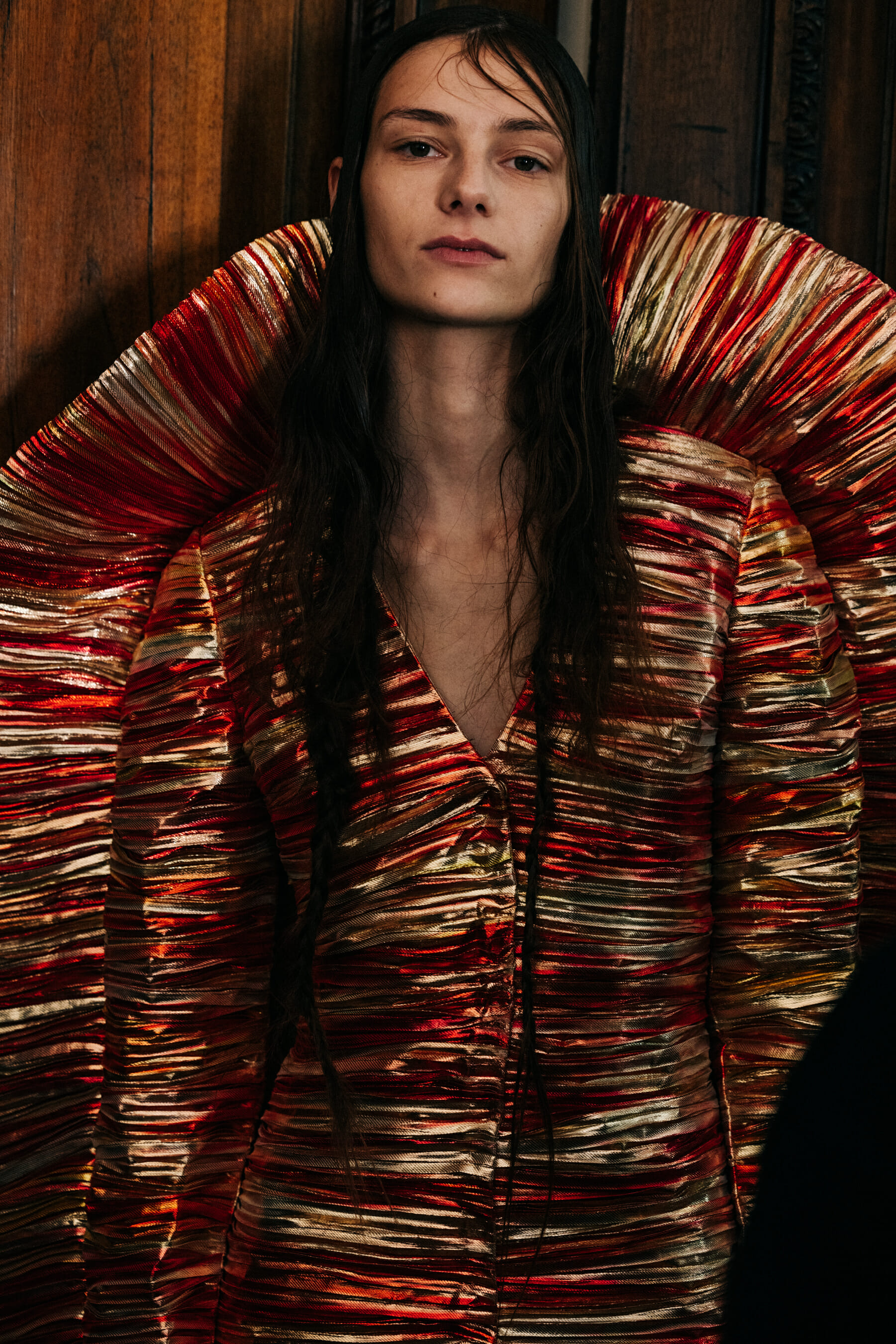 Model wearing metallic dress
