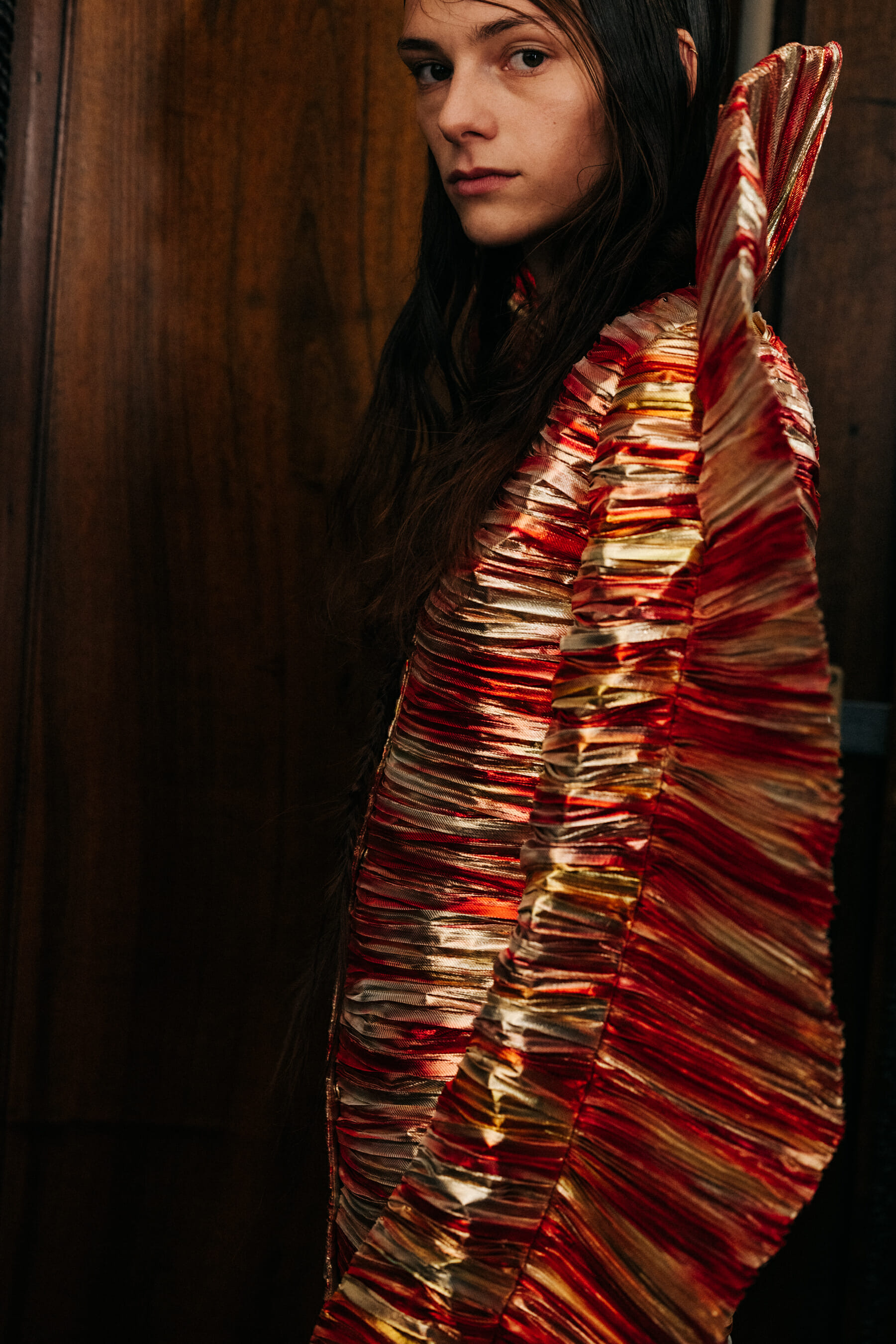 Model wearing metallic dress