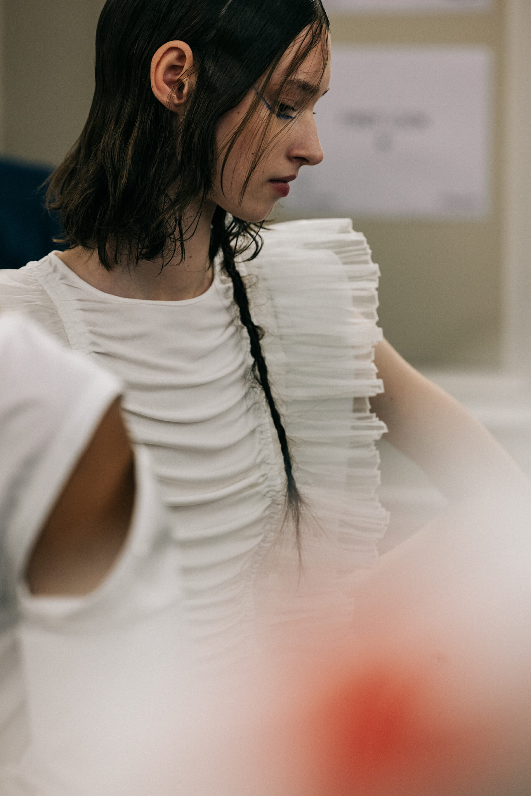 Model wearing white dress