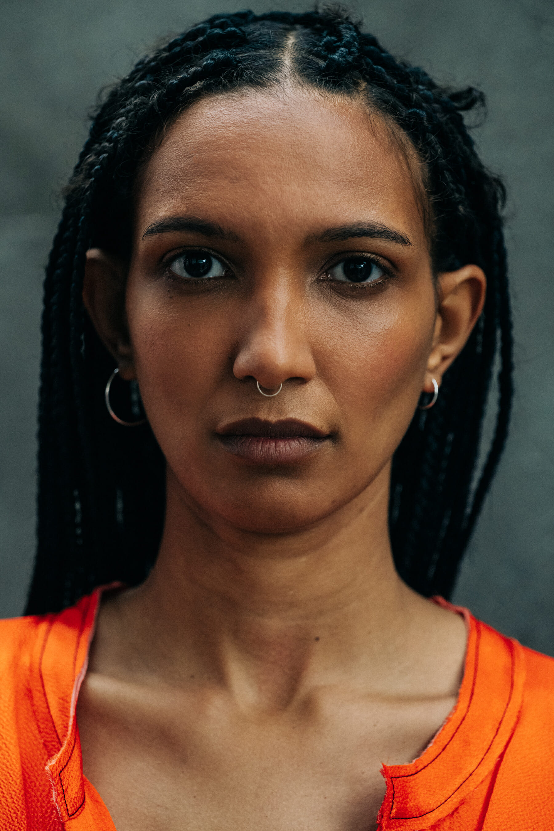 model backstage wearing orange