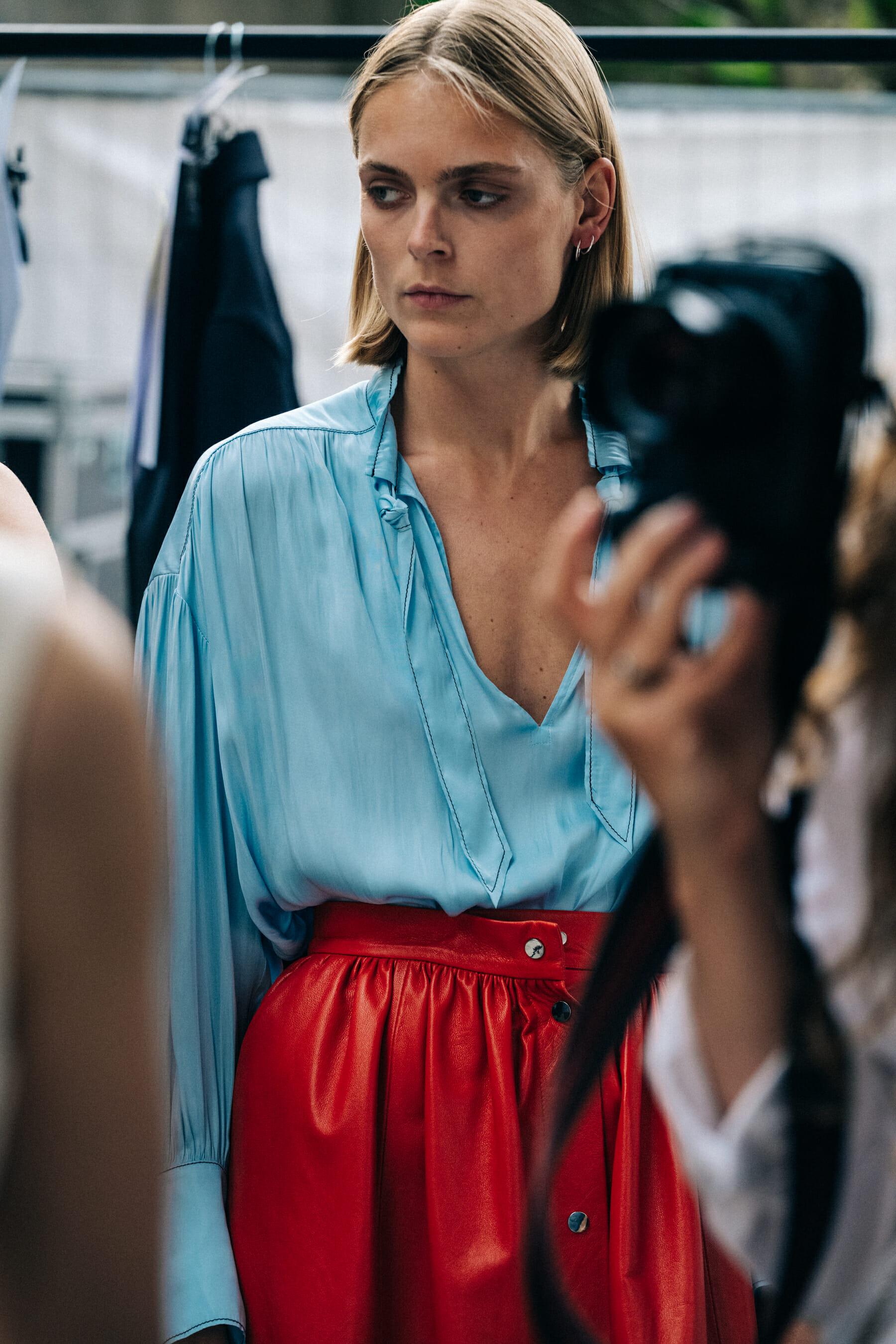 Model backstage blue blouse