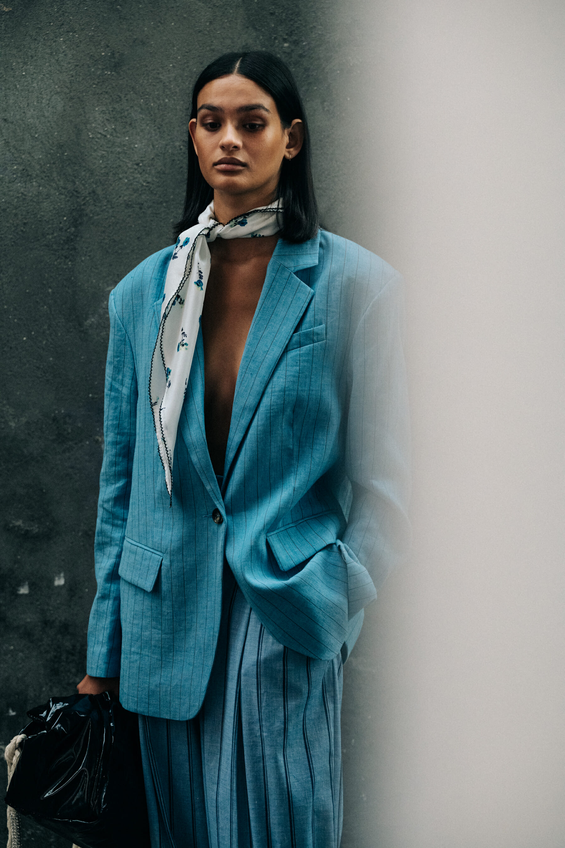 Model backstage wearing blue